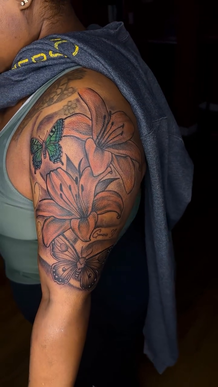 Flowers and butterflies on arm fine line tattoo on the upper arm by TC 🧚🏽, Columbus, OH