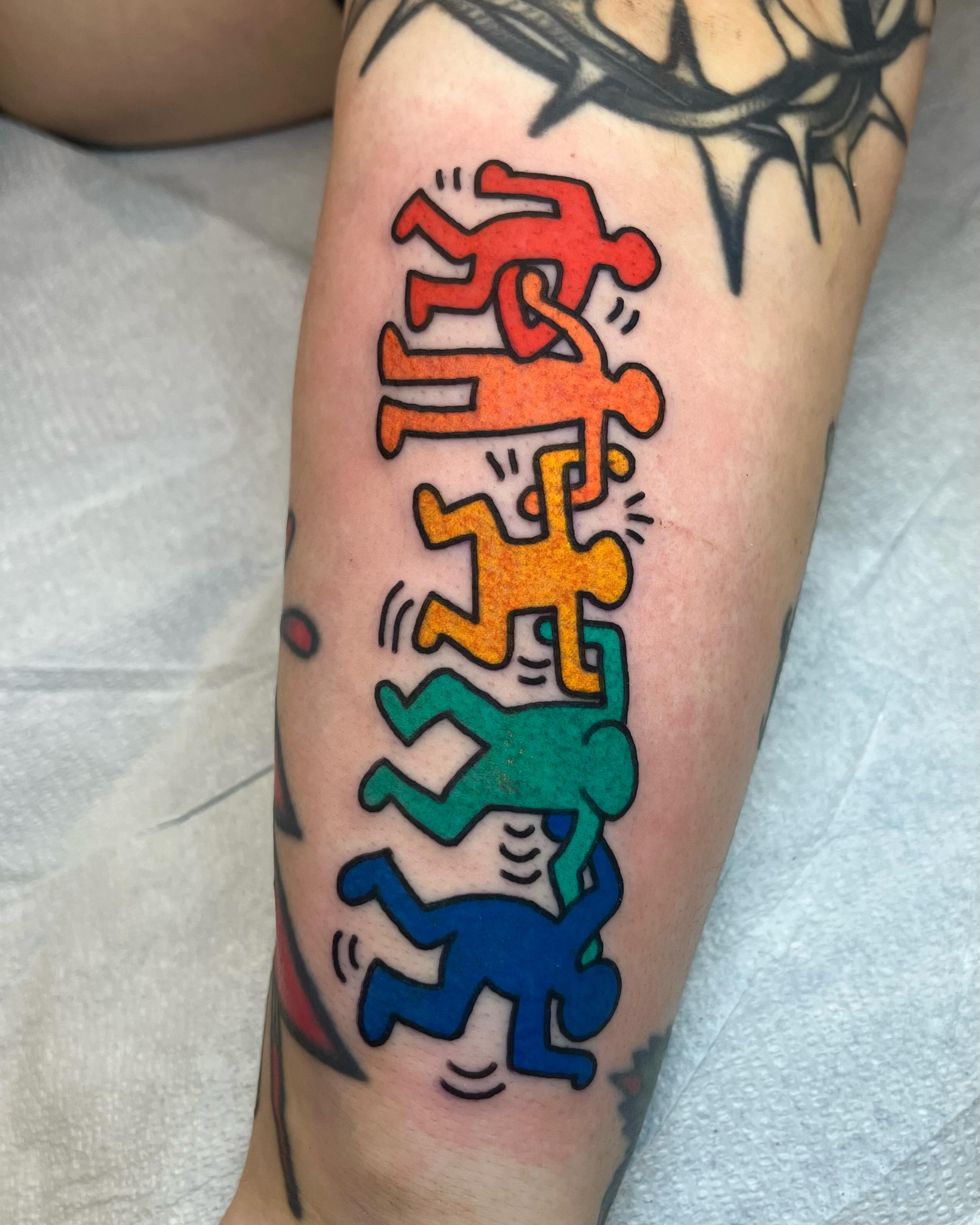 Running figures new school tattoo on the forearm by Em Adkins