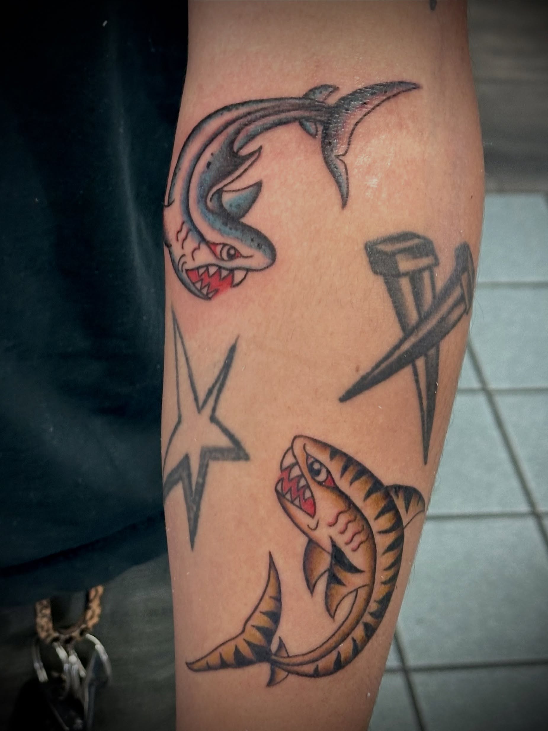 Sharks and nails American traditional tattoo on the forearm by 🥀Chloe Miller
