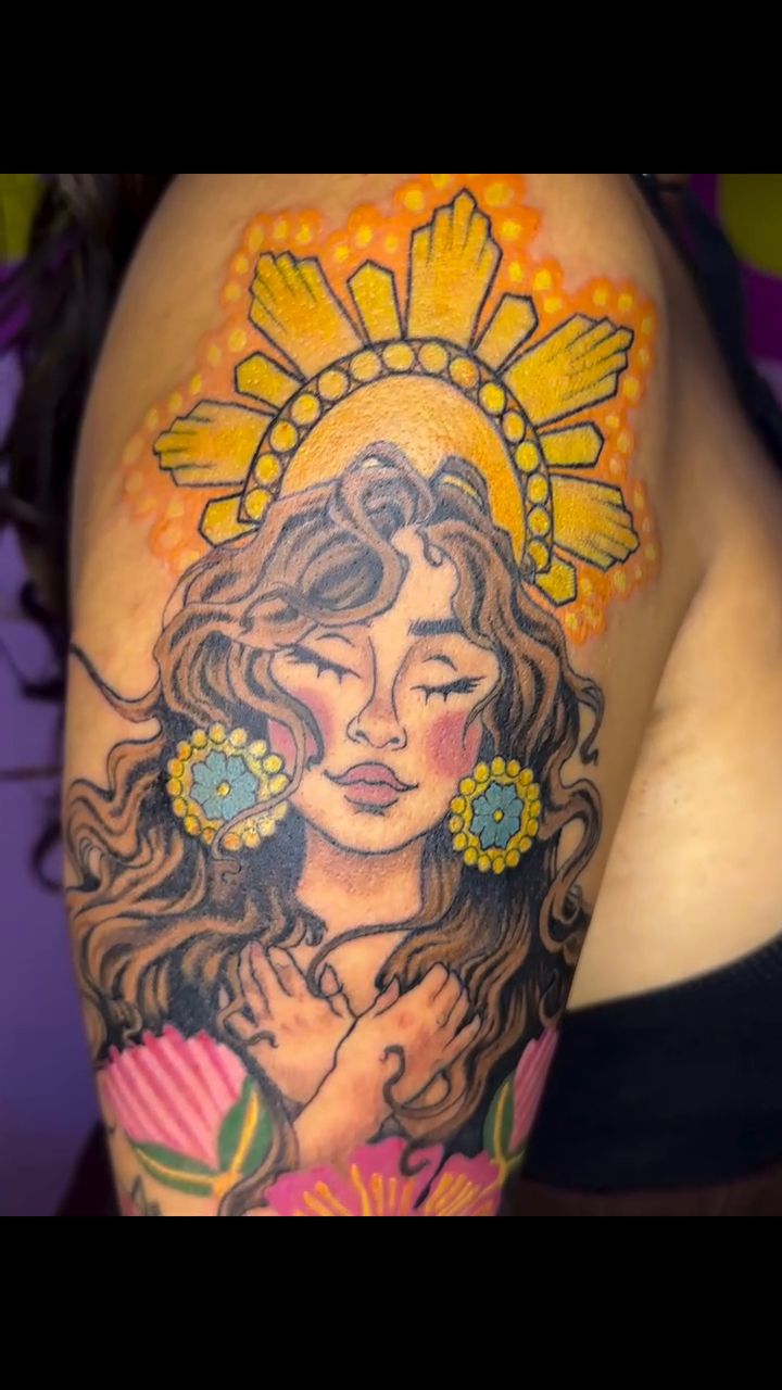 Woman with sun halo and flowers neo-traditional tattoo on the shoulder by @katikattattoos, Las Vegas, Nevada