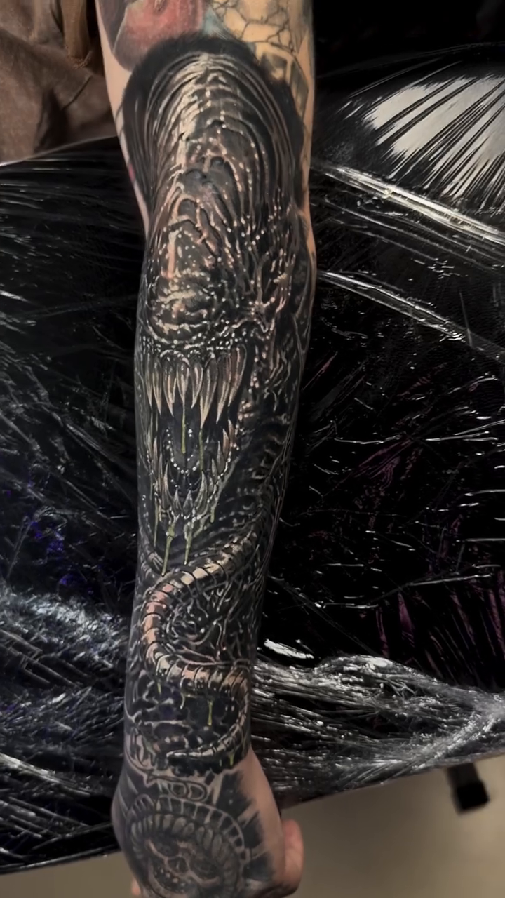 Dragon sleeve tattoo realism tattoo on the forearm by Steven Pelkey, Eastpointe, Michigan