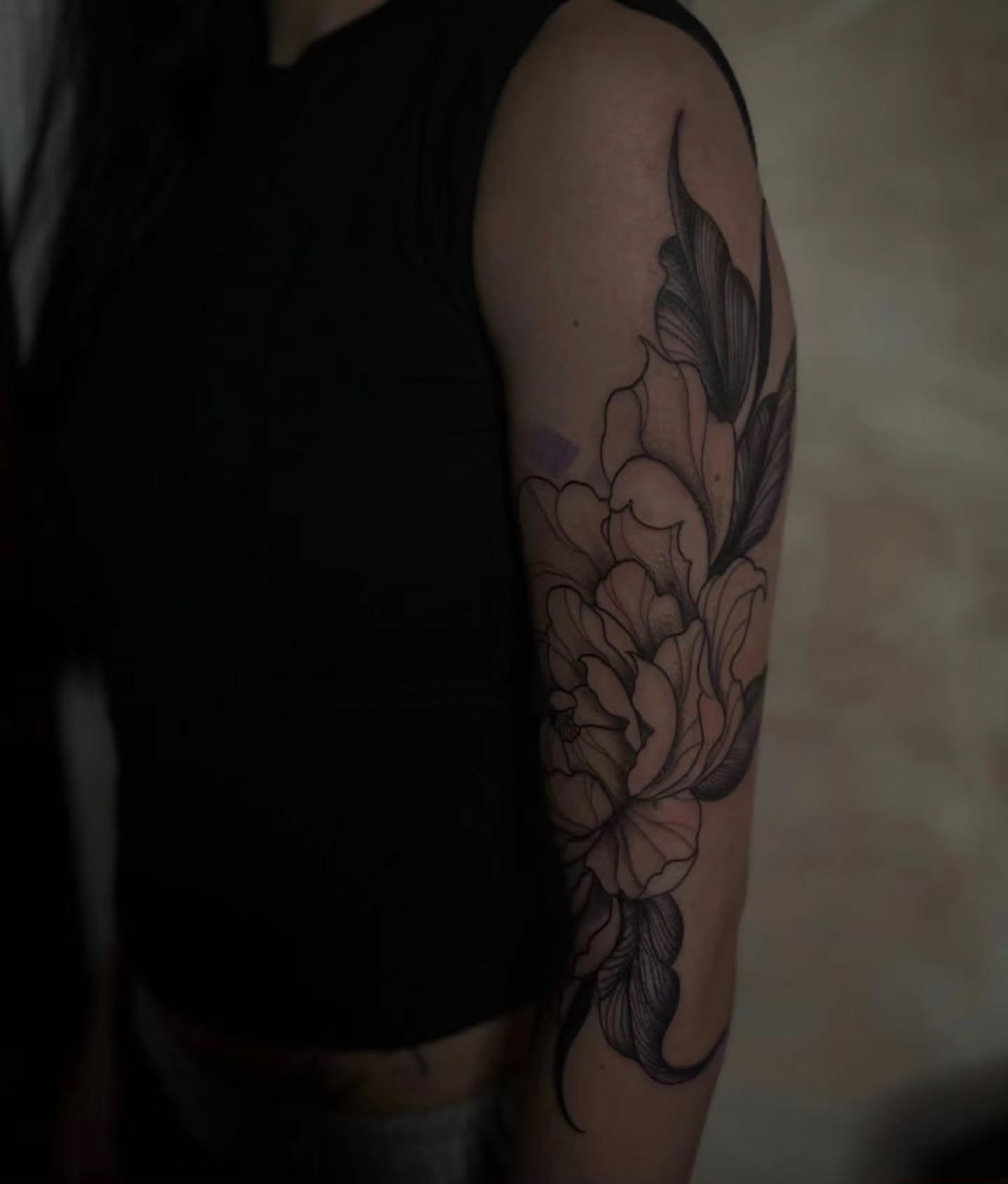 Peony flowers black and grey tattoo on the forearm by Angie Milano