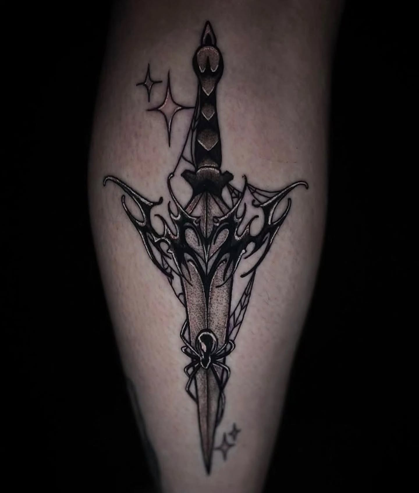 Sword black and grey tattoo on the forearm by Angie Milano