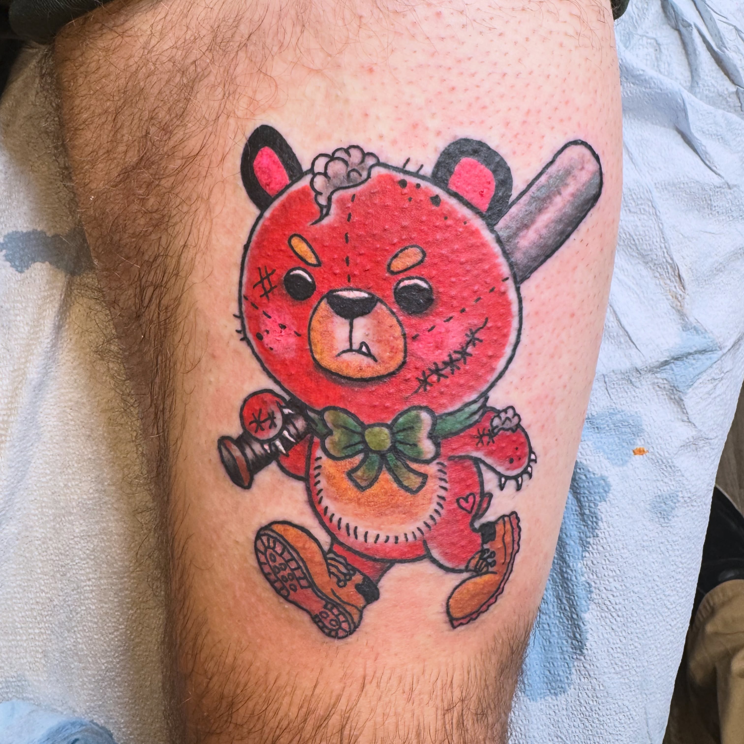Teddy bear American traditional tattoo on the thigh by Aidan Monahan Tattoo