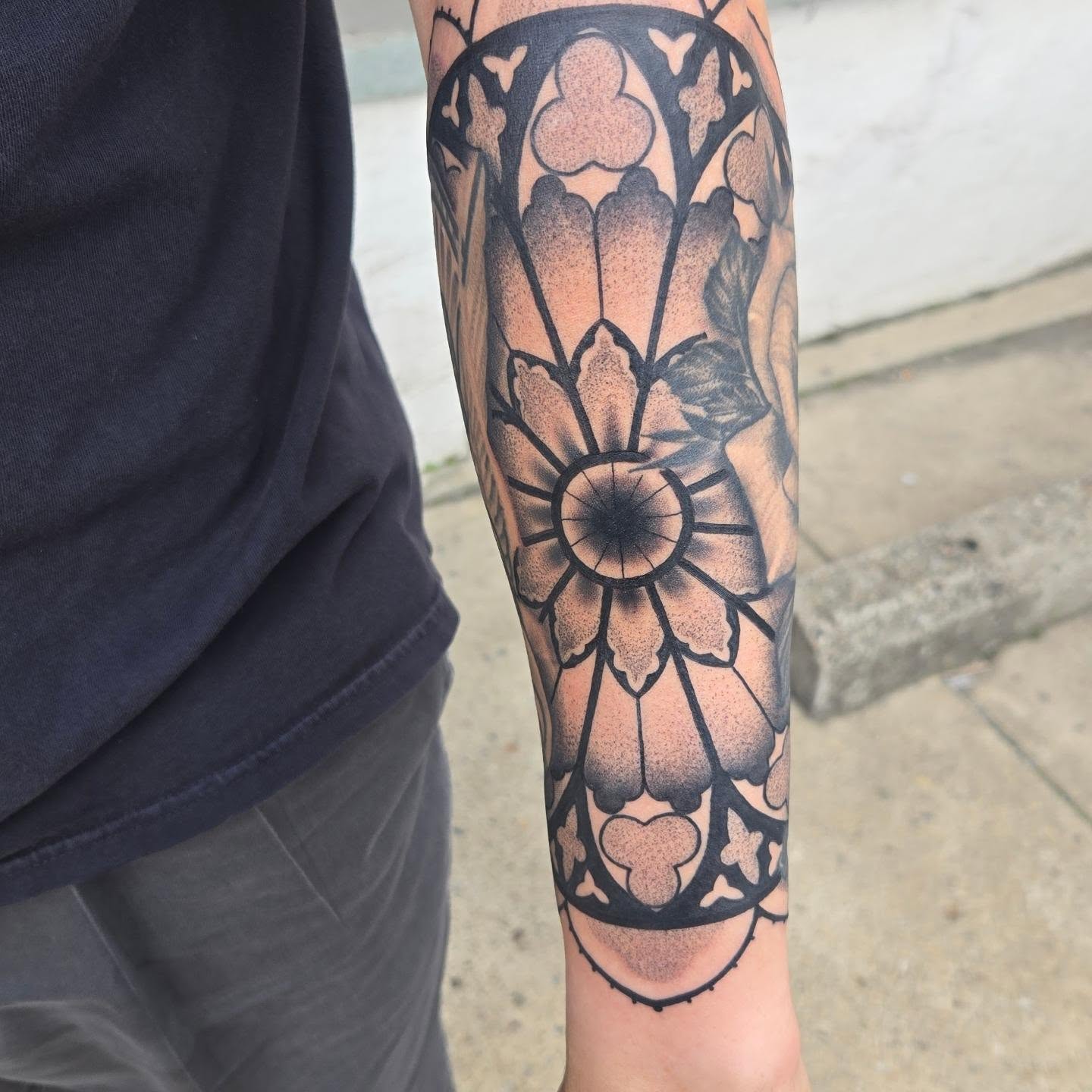 Geometric floral dotwork tattoo on the forearm by Angel O'Connor Tattoos