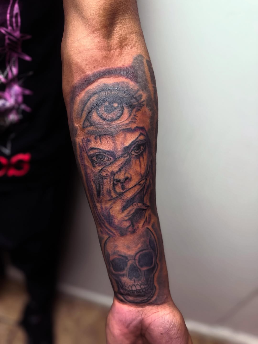 Eye, face, and skull realism tattoo on the forearm by Uncle Fade Tattoo Artist ✍🏾