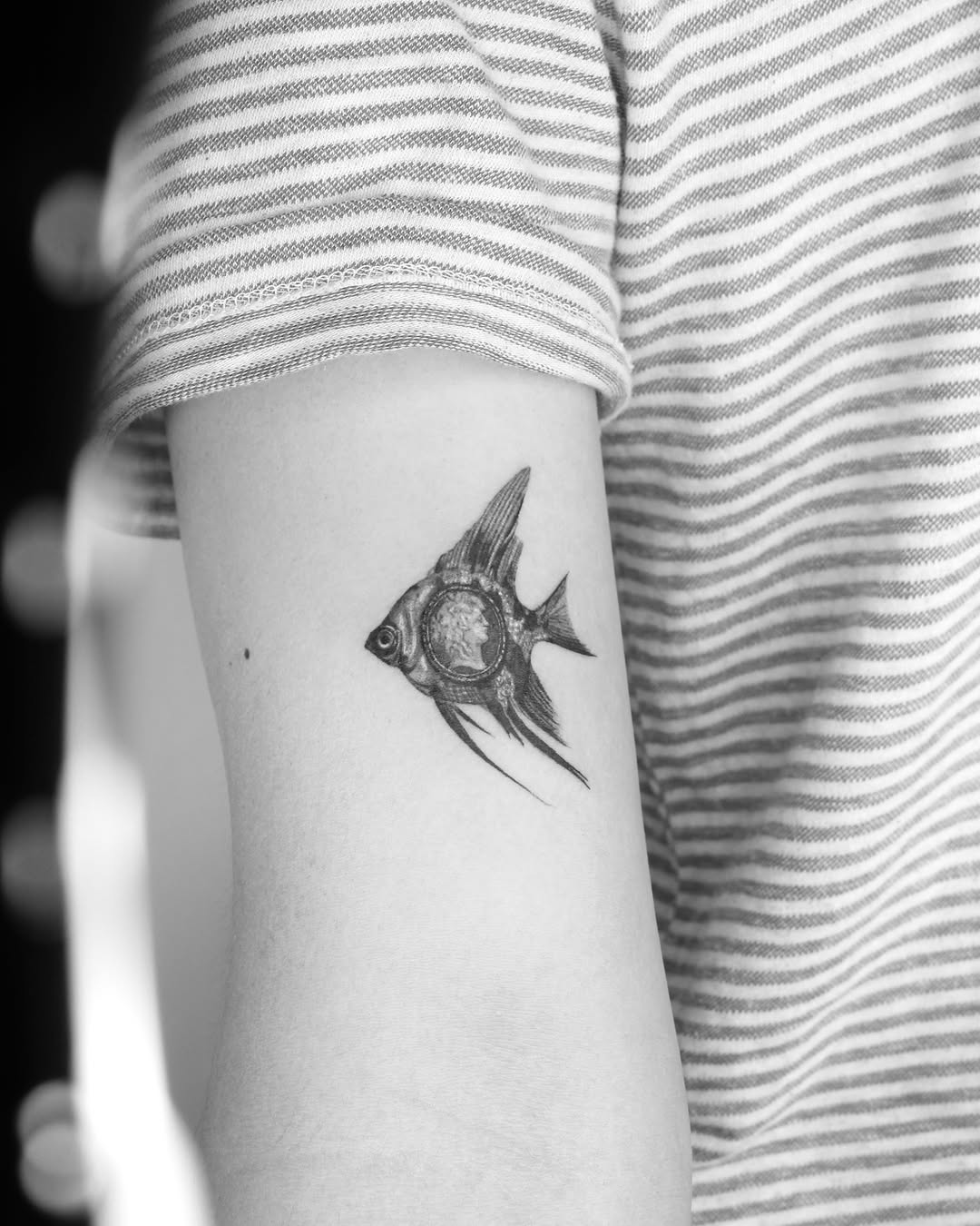 Tattoo by @tatmostat — black_and_grey, realism