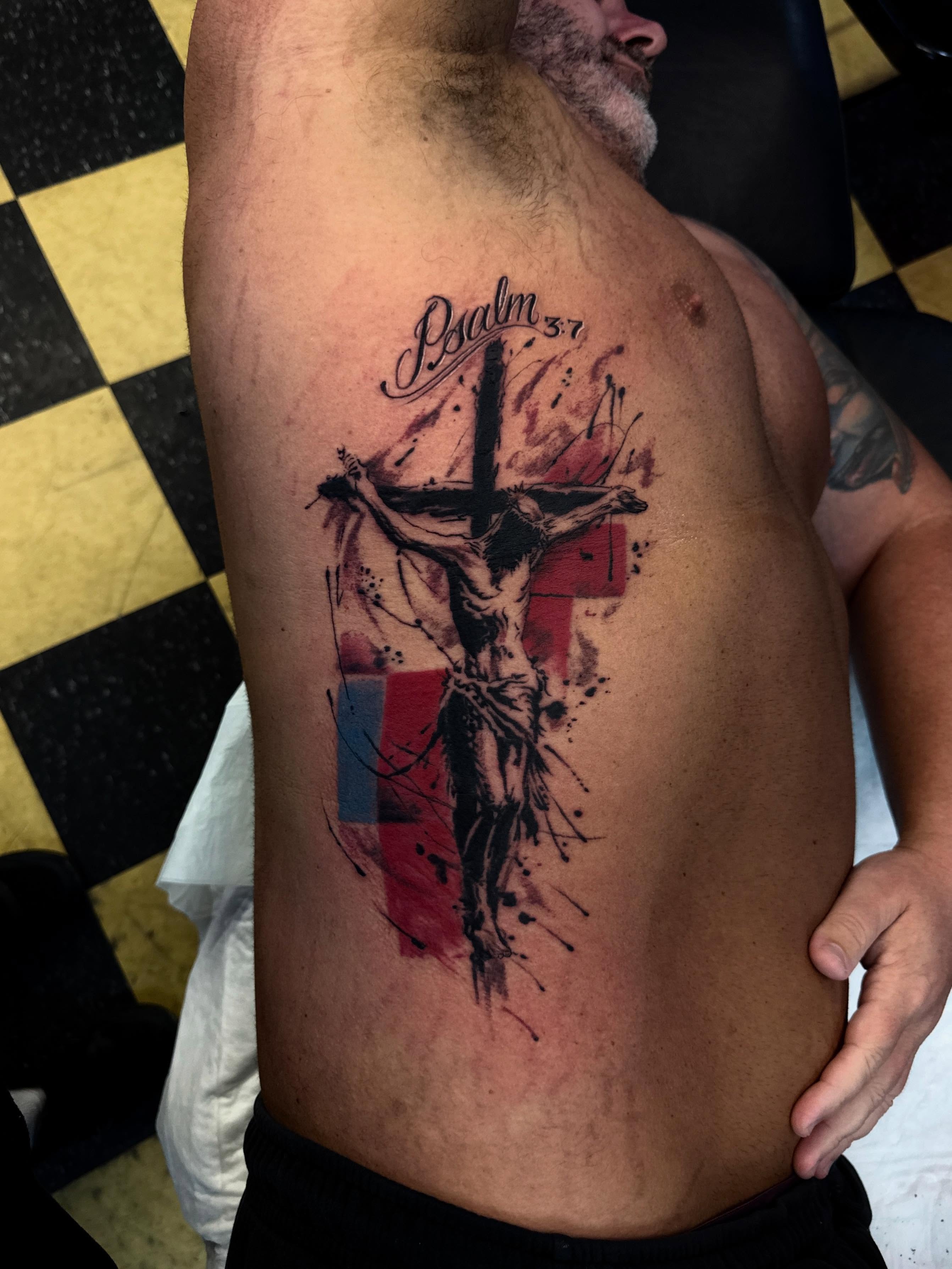 Religious crucifixion scene dotwork tattoo on the ribs by Gary Chase