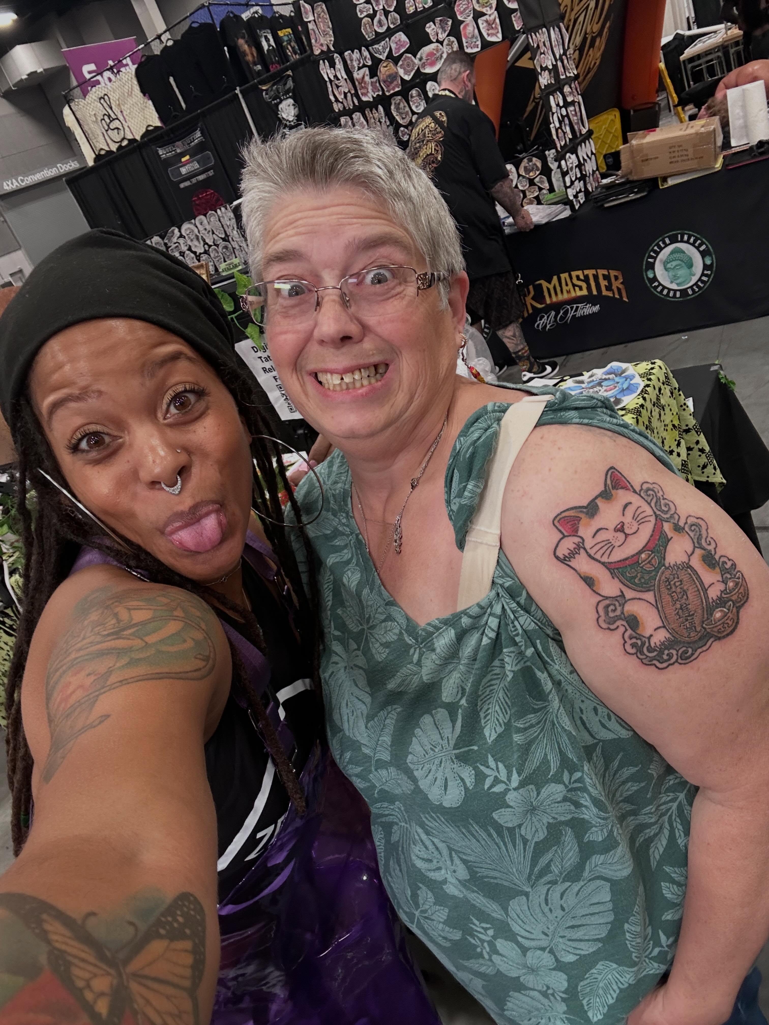 Cat American traditional tattoo on the shoulder by Zen Forbes