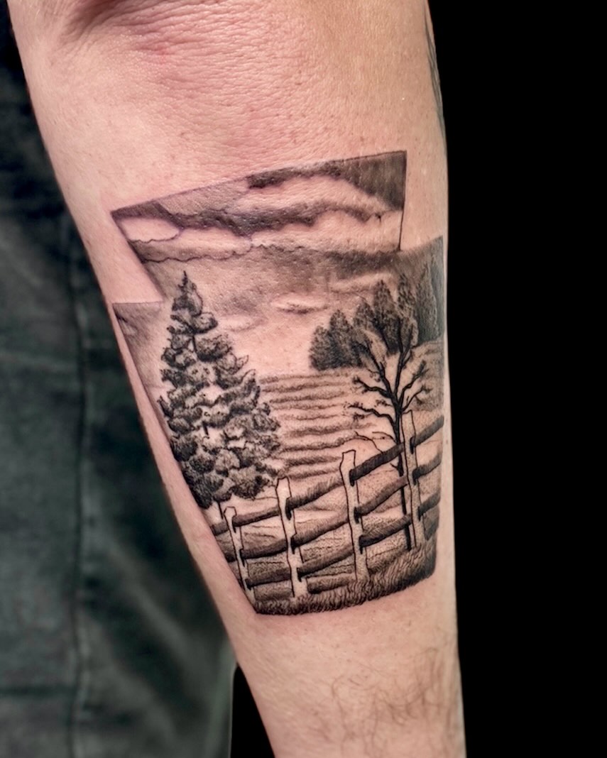 Landscape realism tattoo on the forearm by Cody Glenn
