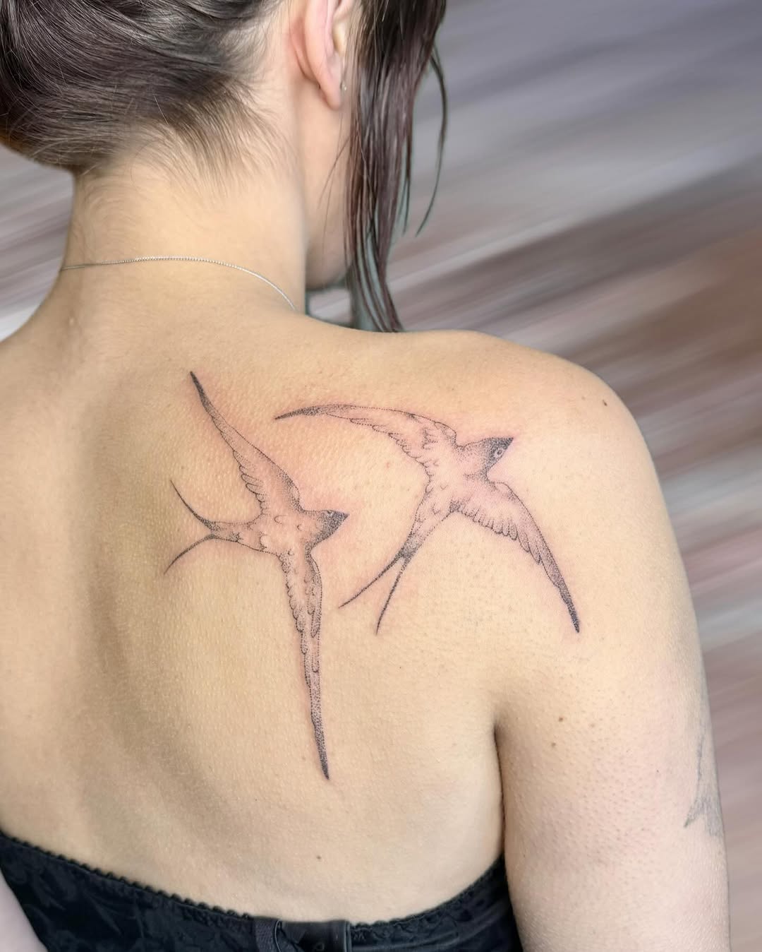 Two swallows fine line tattoo on the back by GG ๐ธ
