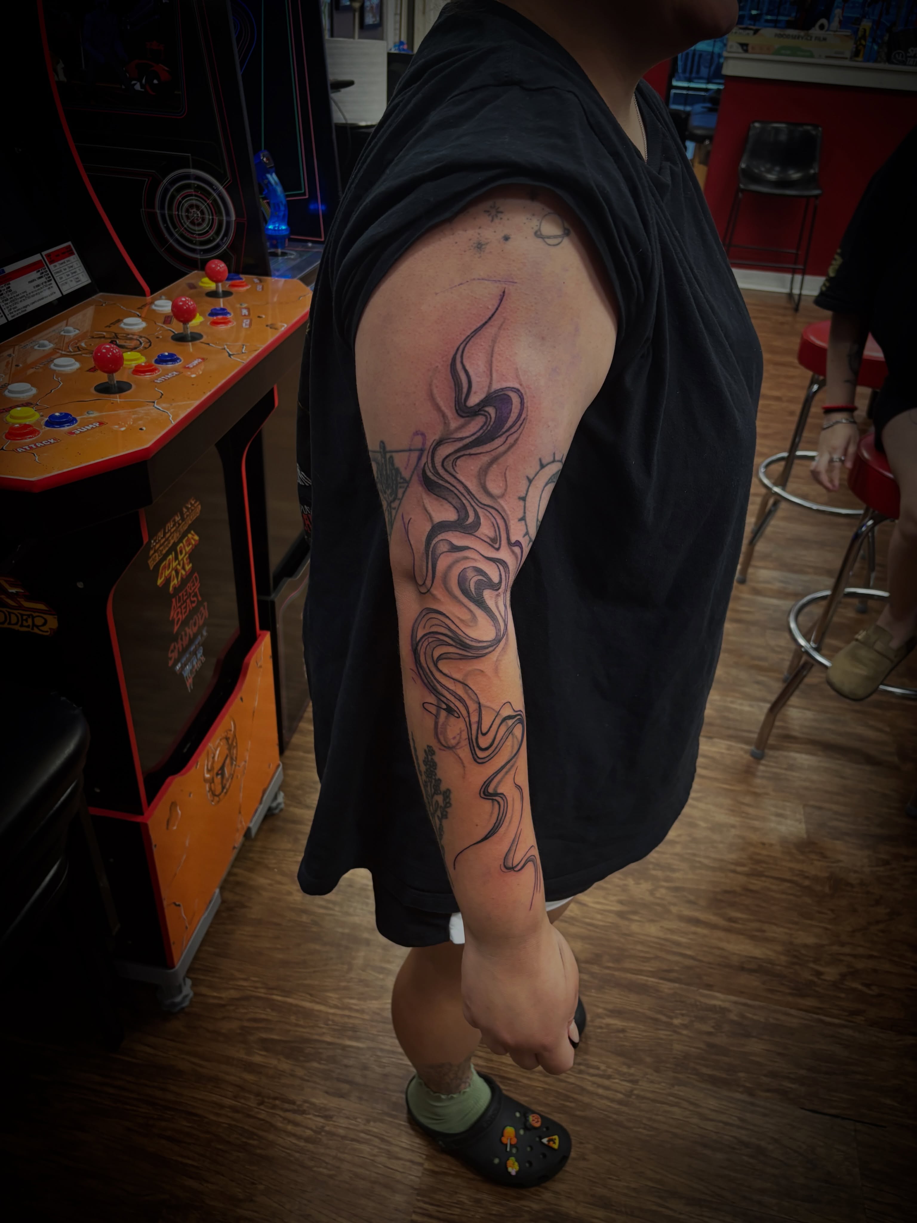 Abstract swirls black and grey tattoo on the forearm by Thom Johns-Green
