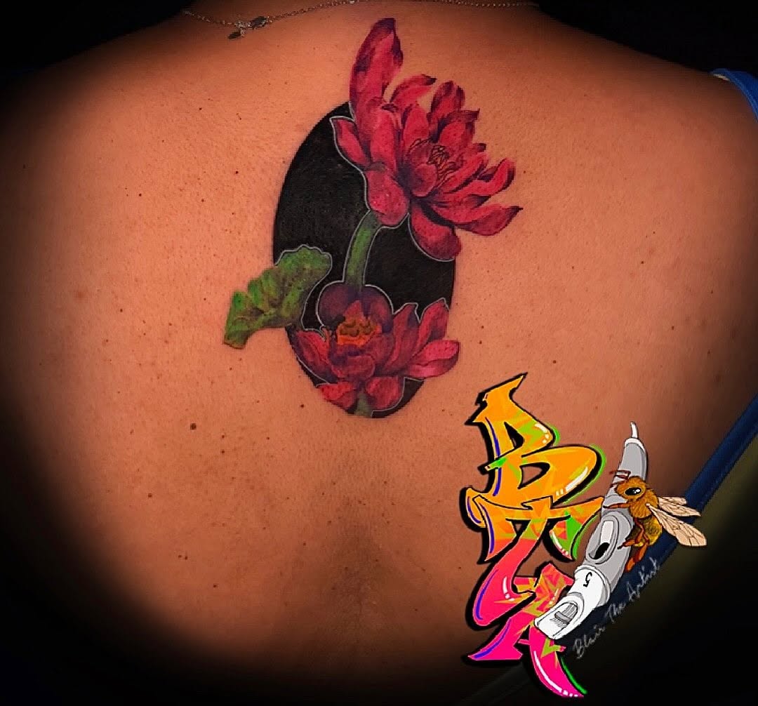 Lotus flowers neo-traditional tattoo on the back by Blair The Artist!
