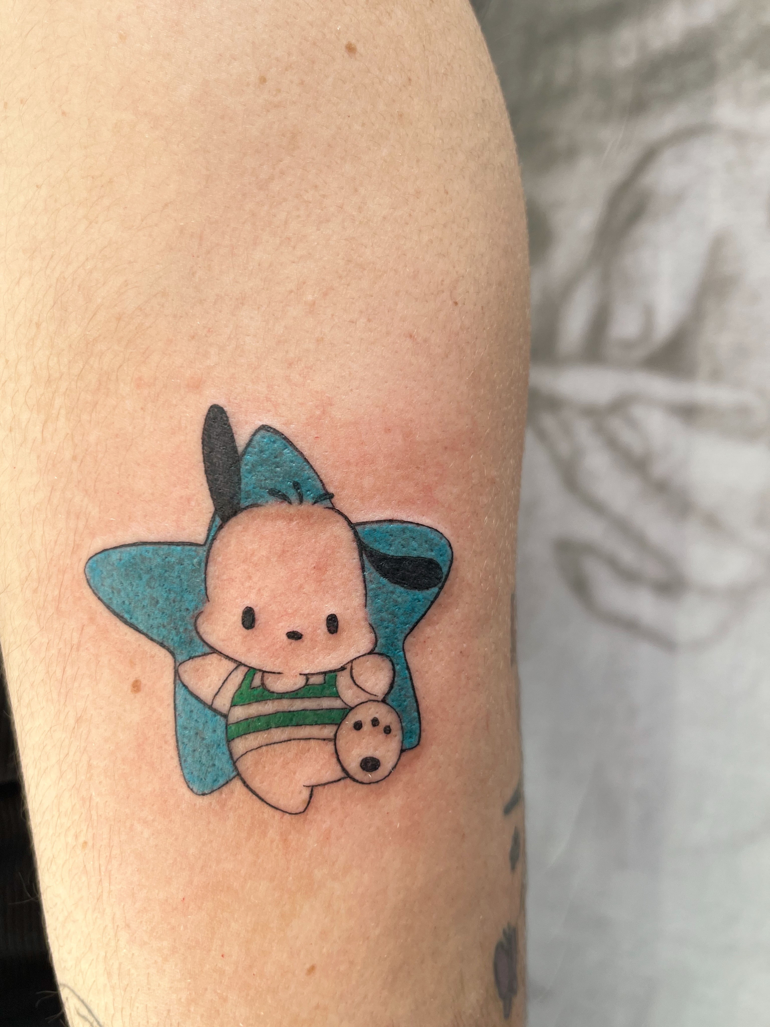 Baby in star dotwork tattoo on the forearm by Kyra Monterrosa