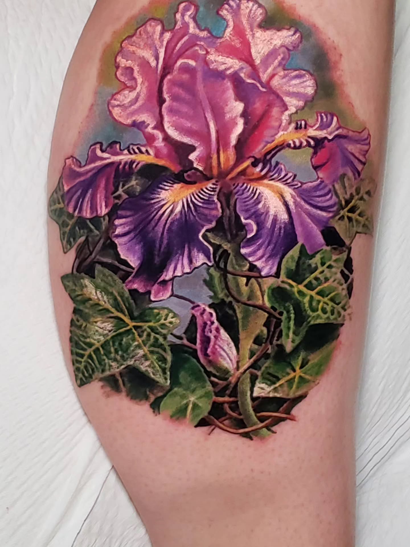 Iris realism tattoo on the thigh by Bruce Riehl