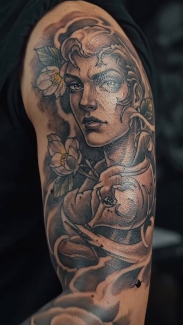 Realism tattoo on the upper arm by Tattoos by Dan Hatcher Carr, Parma, Ohio