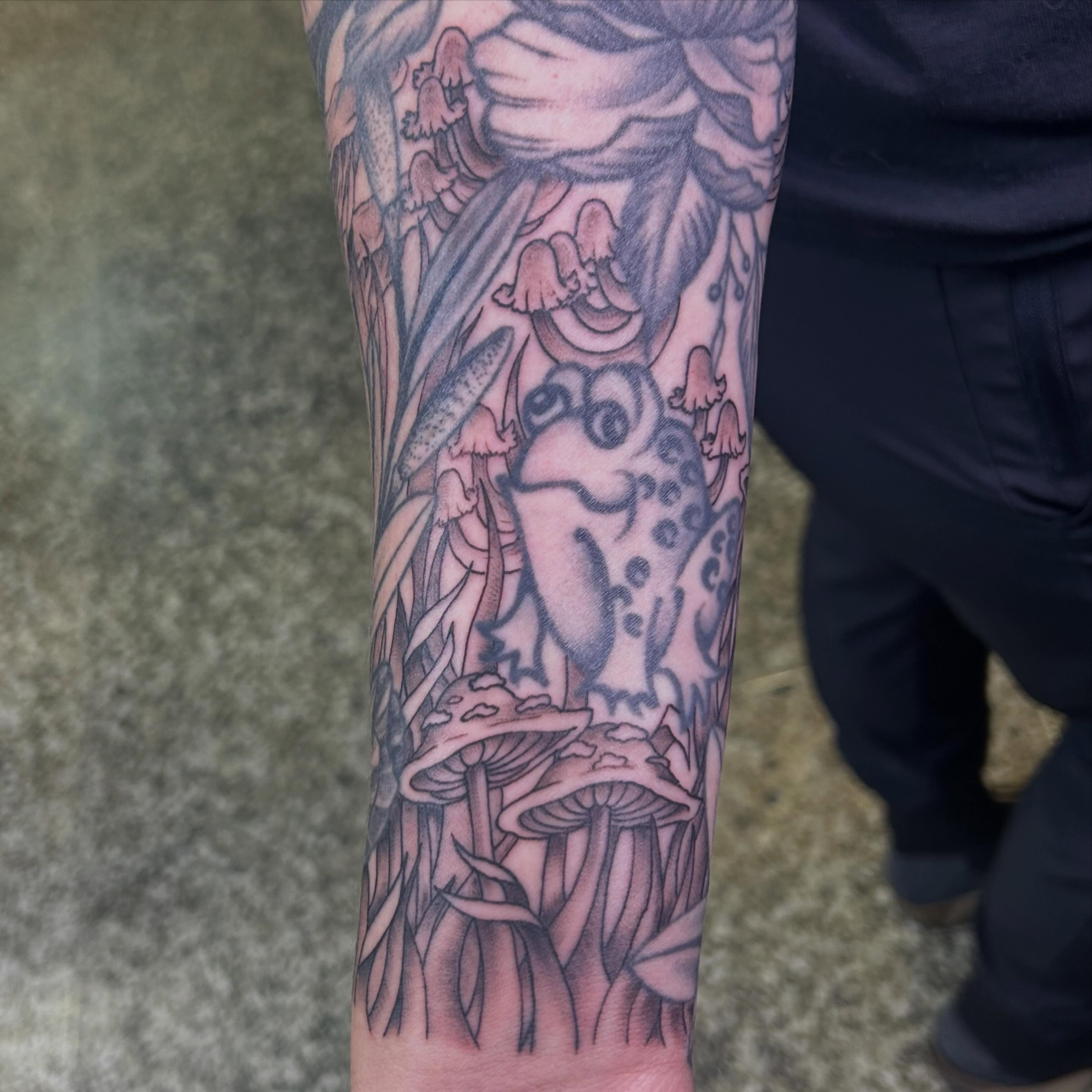 Bird among mushrooms realism tattoo on the forearm by Norfolk Tattooer, Norfolk, Virginia