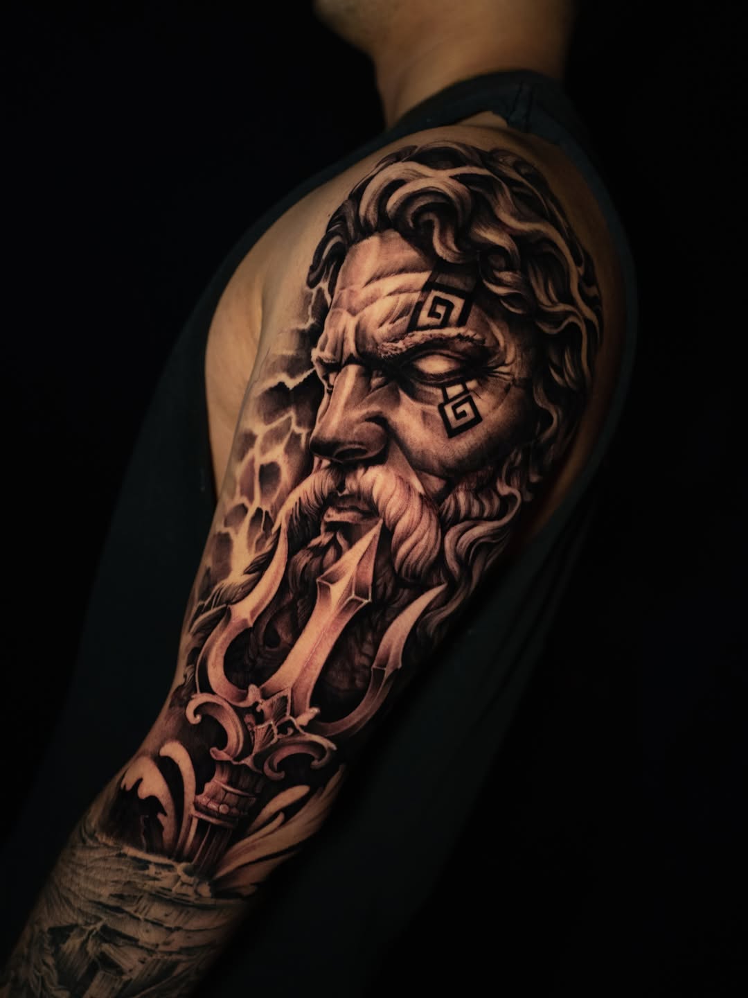Poseidon with trident realism tattoo on the shoulder by Apolo