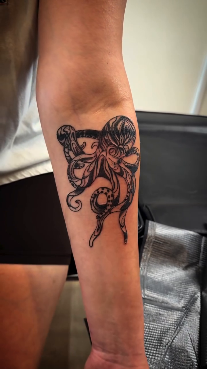 Octopus tattoo tribal tattoo on the forearm by TolzinInk, Brookings, South Dakota