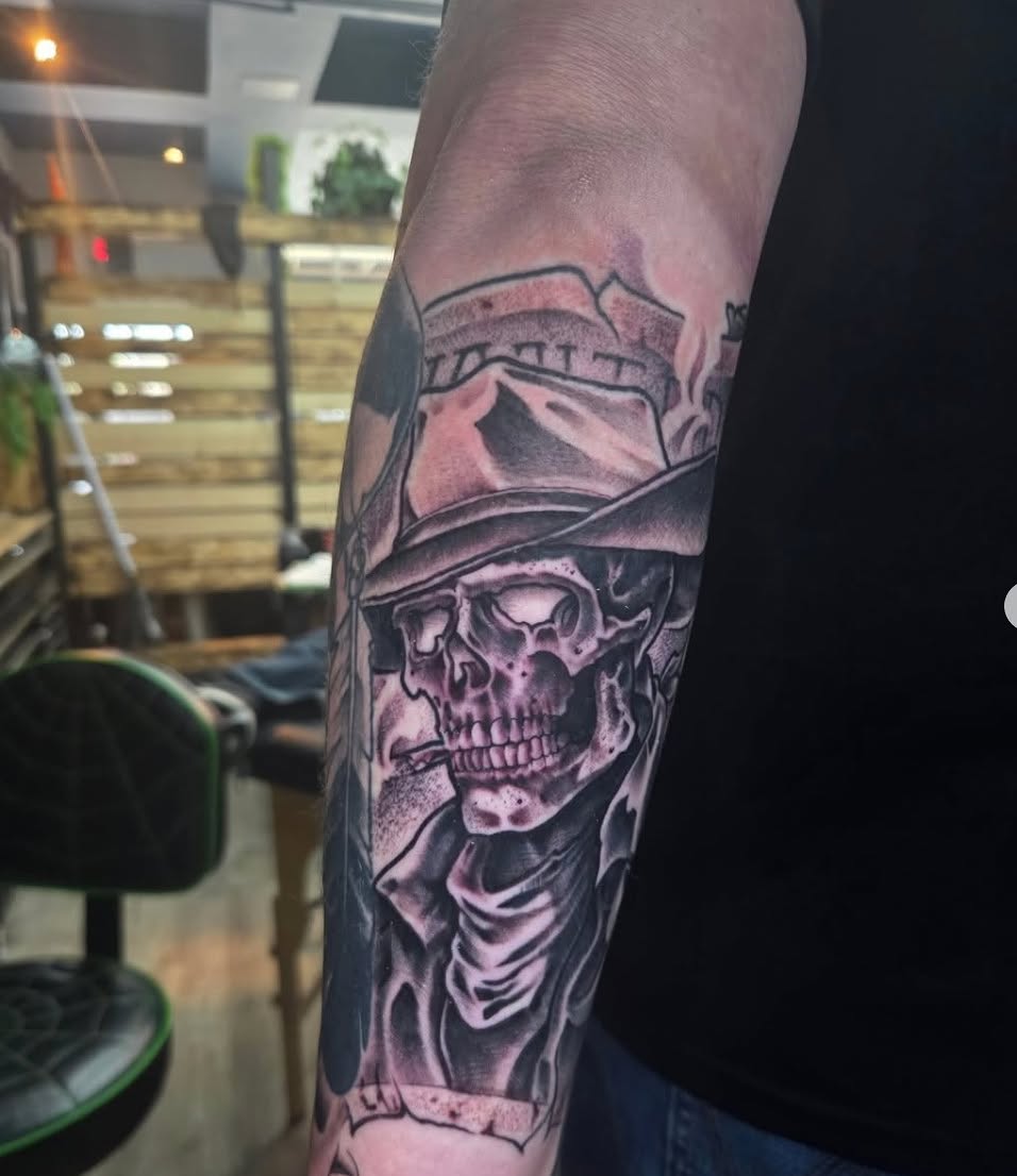 Skull wearing hat realism tattoo on the forearm by Geo