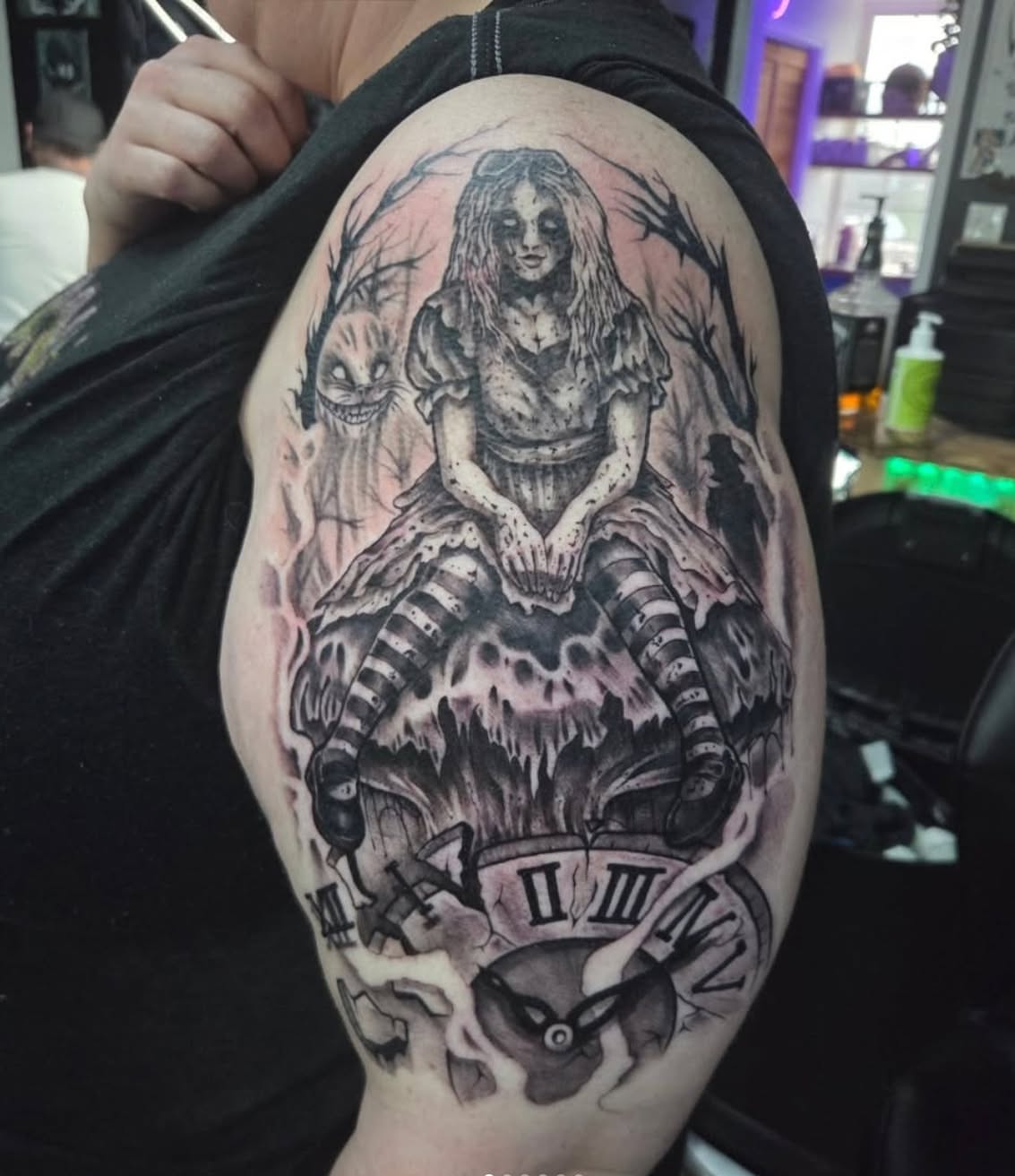 Alice in Wonderland realism tattoo on the shoulder by Geo