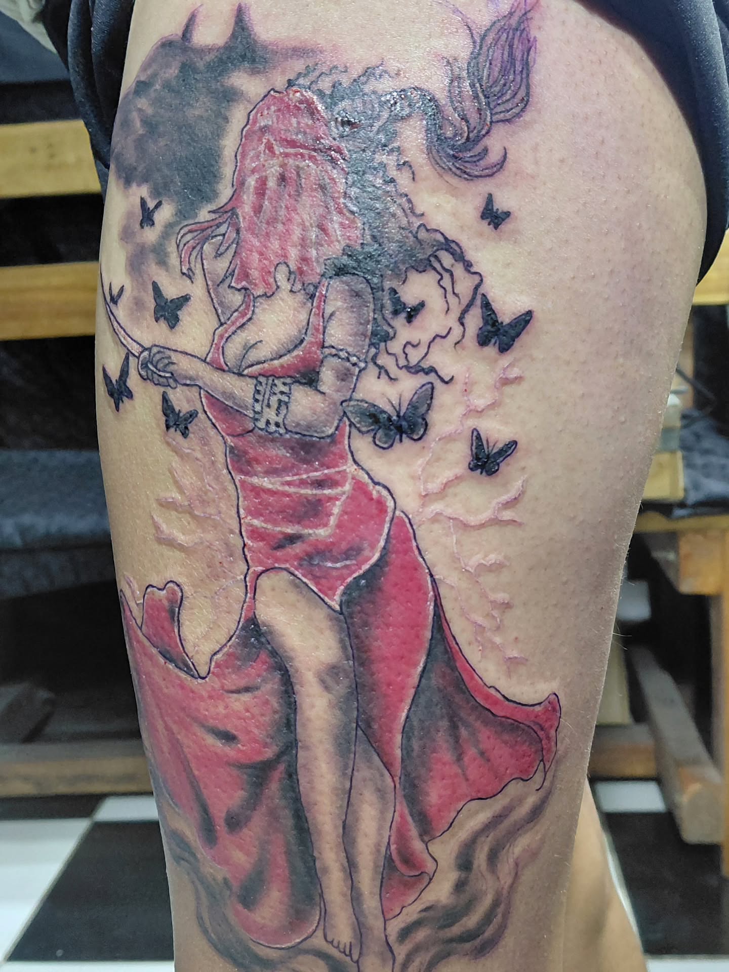 Dancing couple American traditional tattoo on the thigh by Jose Rodriguez