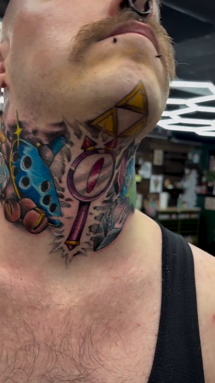 New school tattoo on the neck by Robbie Reel, Wichita, Kansas