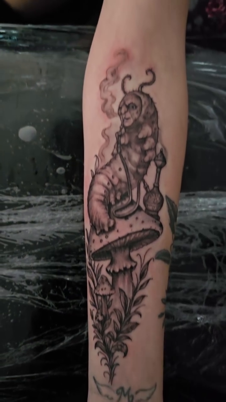 Caterpillar on a mushroom dark realism tattoo by Jesse James, Las Vegas, Nevada