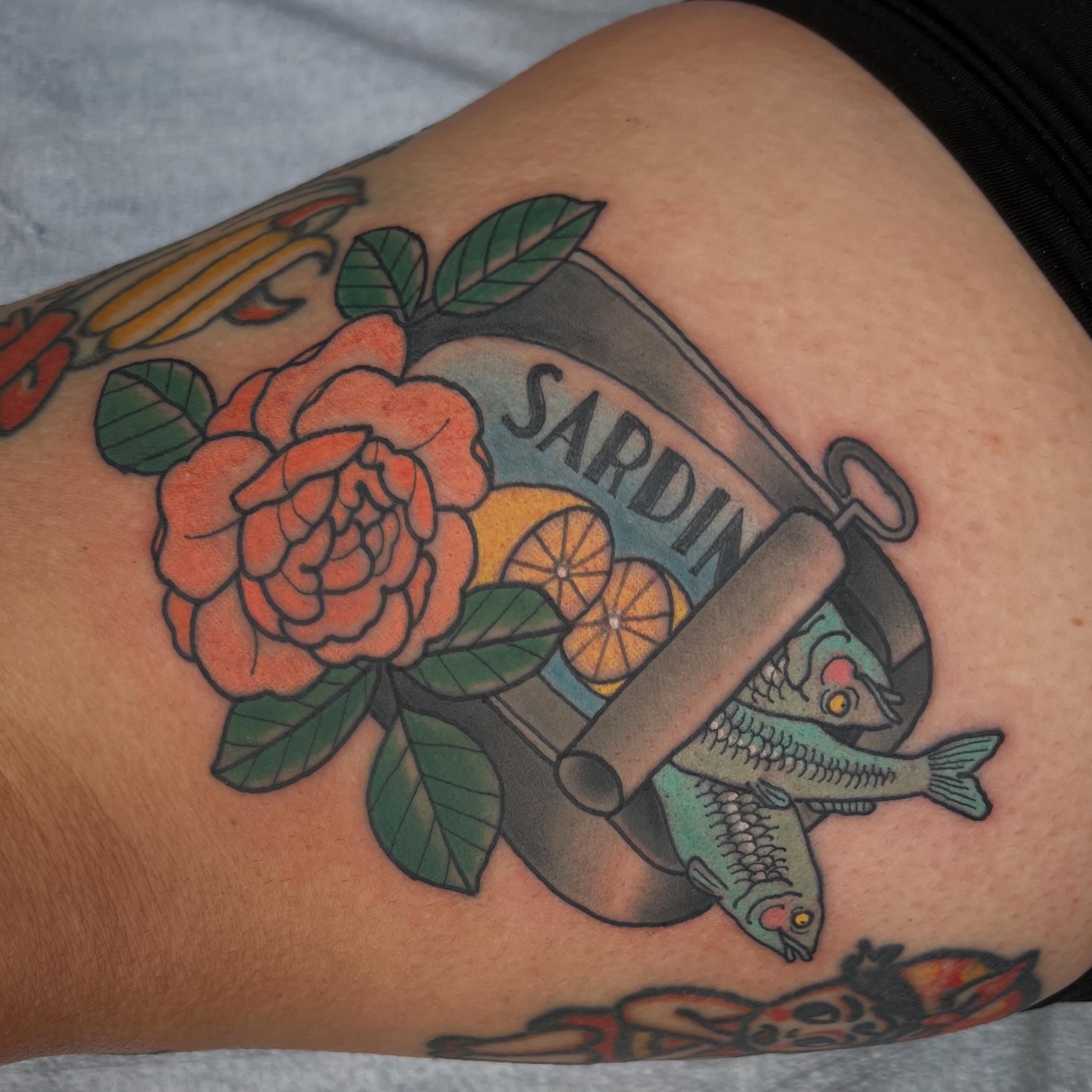 Sardine can with rose and lemons neo-traditional tattoo on the thigh by Troy David Souders