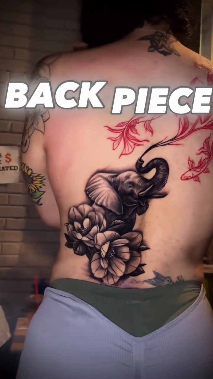 Elephant with flowers and koi fish geometric tattoo on the back by Chicago Tattoo Artist