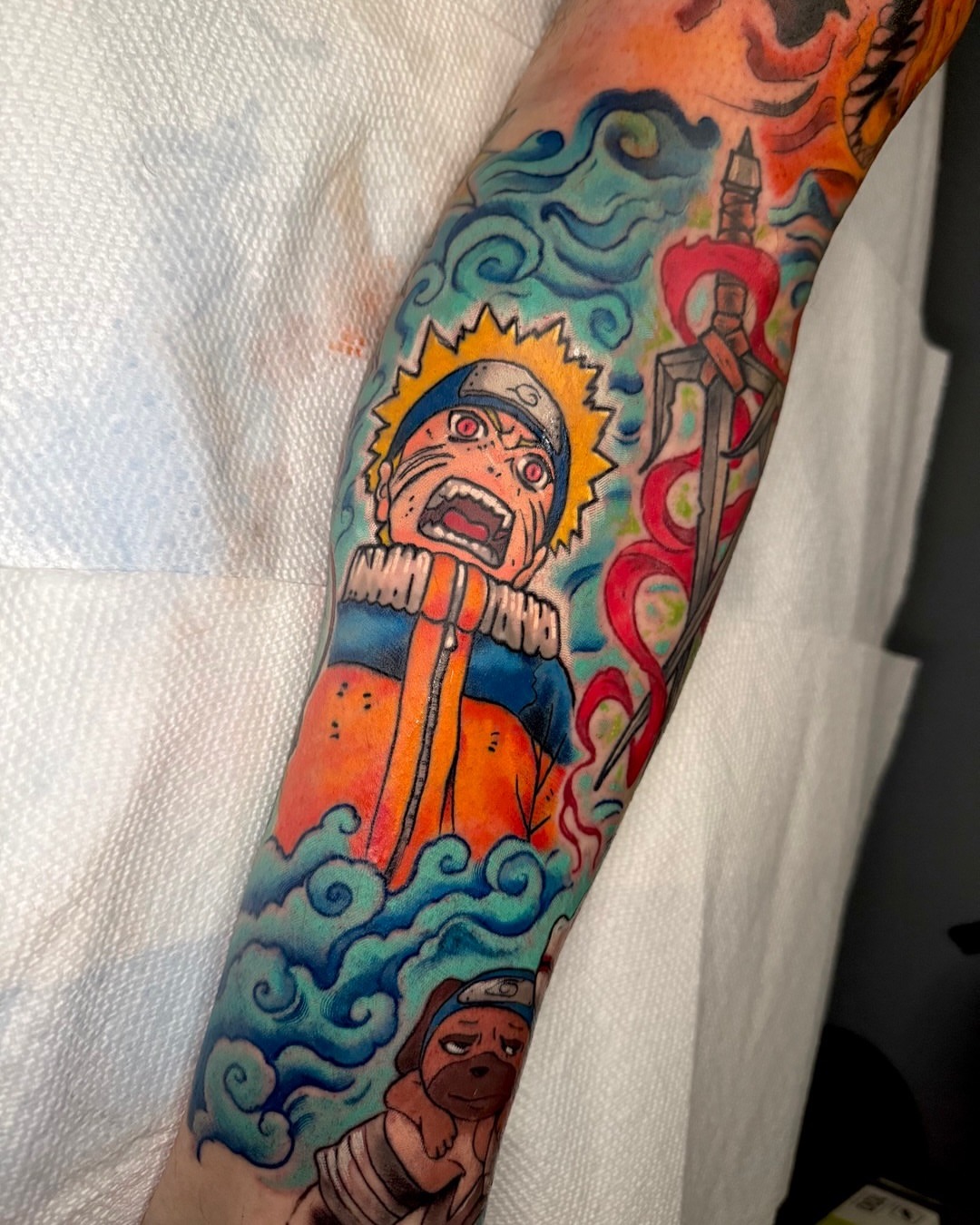Naruto anime tattoo on the forearm by Paul Endres Jr