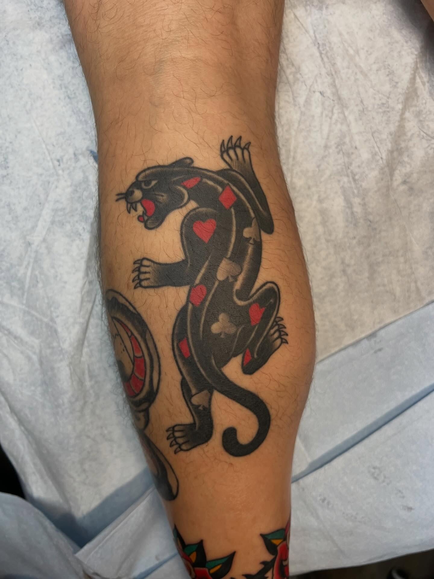 Panther American traditional tattoo on the forearm by Tyler Van Pelt