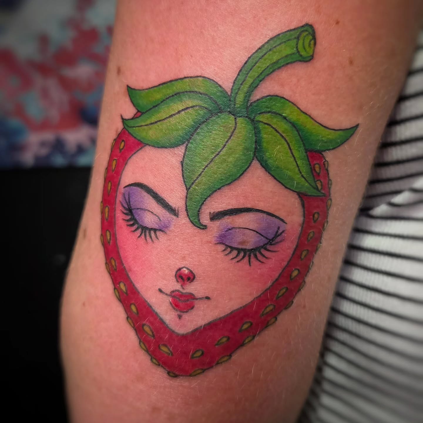 Strawberry face illustrative tattoo on the forearm by Jam ⚡️🐉🖤
