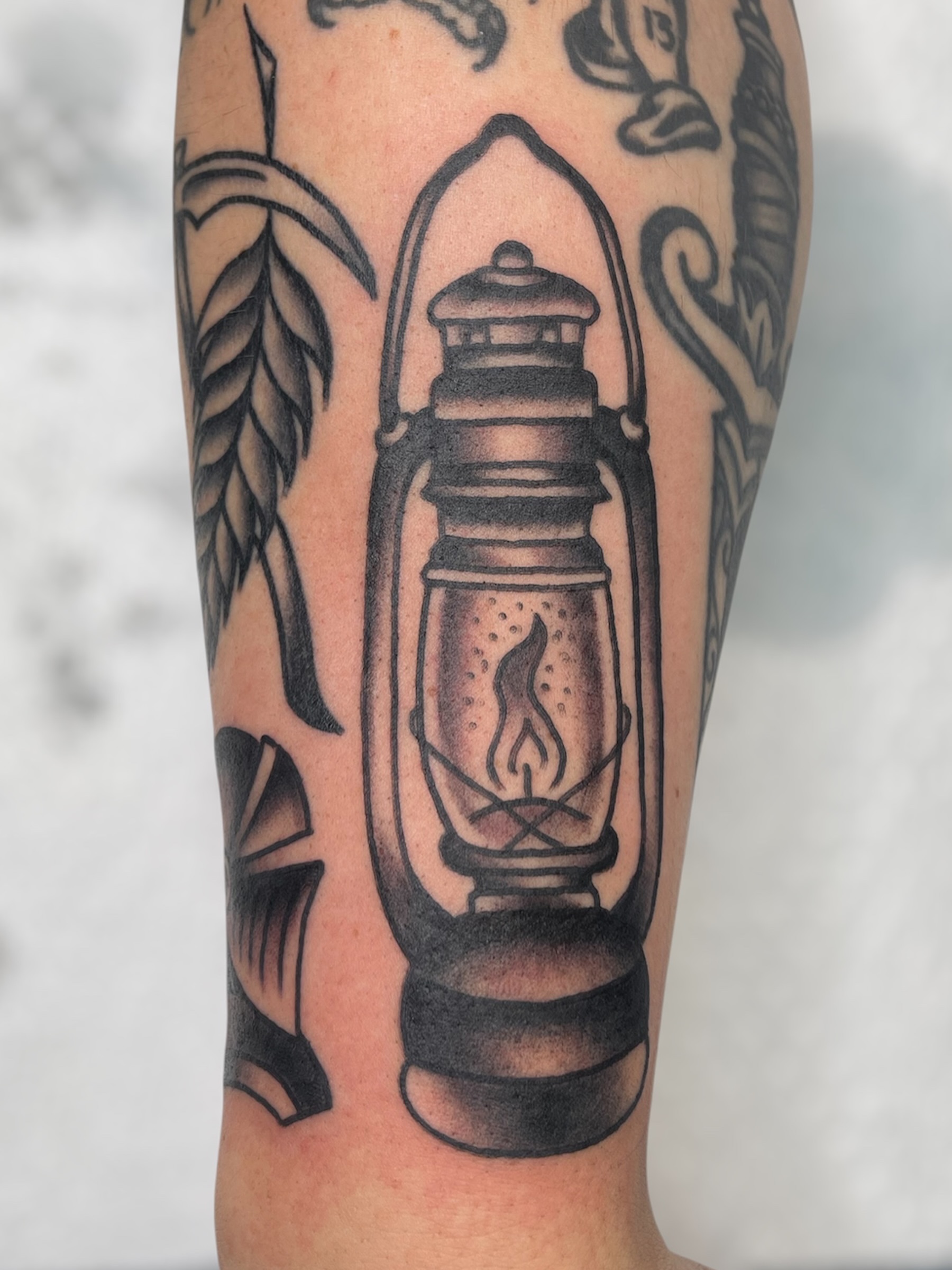 Lantern American traditional tattoo on the forearm by Chris Martin