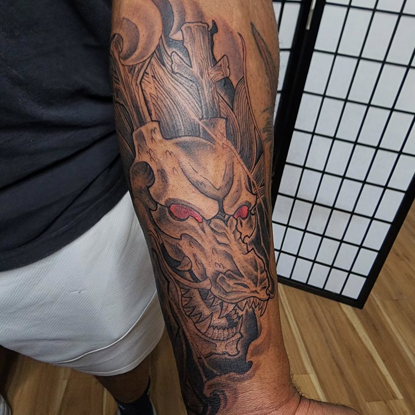 Dragon dark realism tattoo on the forearm by Anthony Moncada