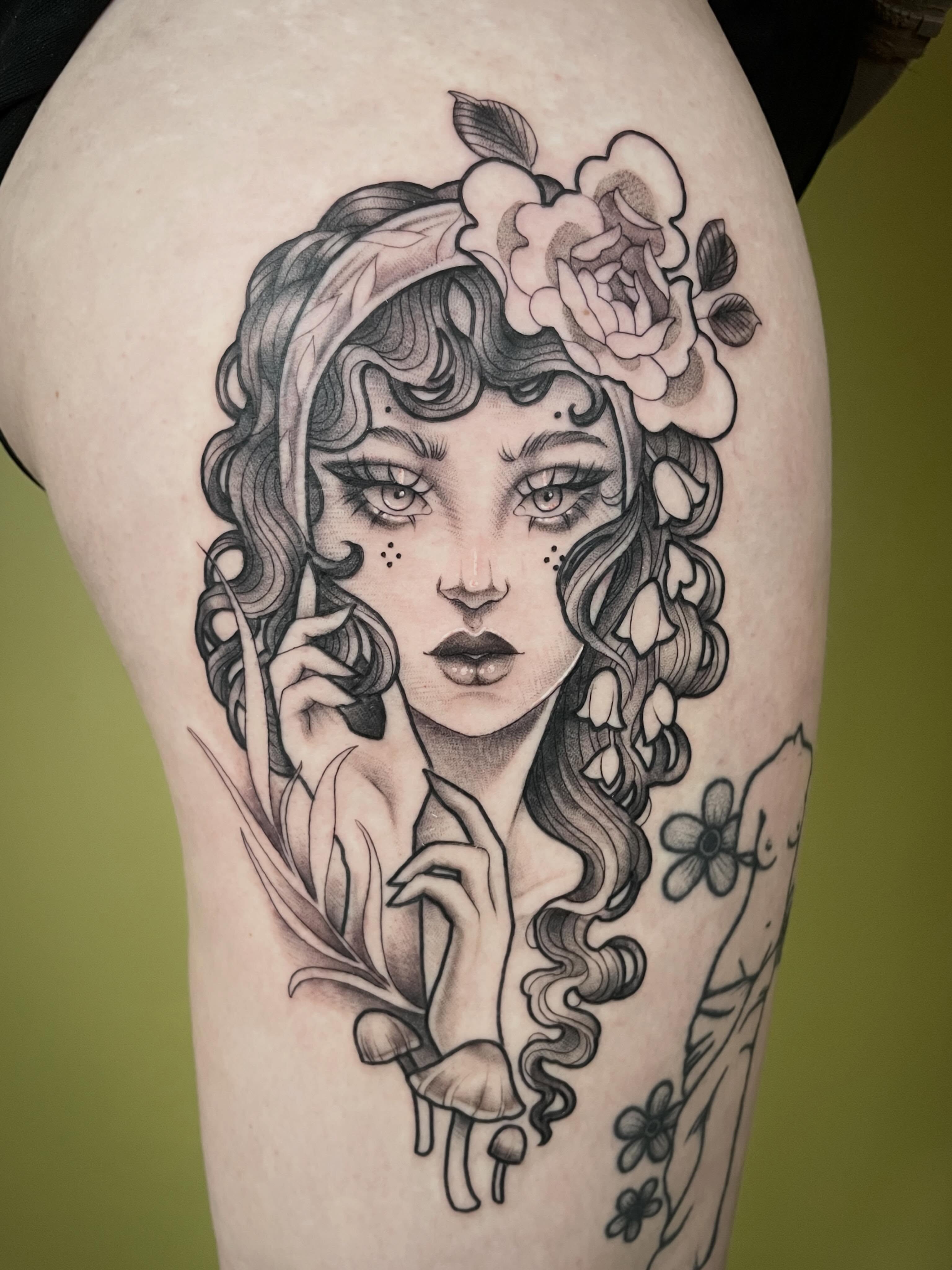 Woman with flowers realism tattoo on the thigh by ✨Erin Haines✨