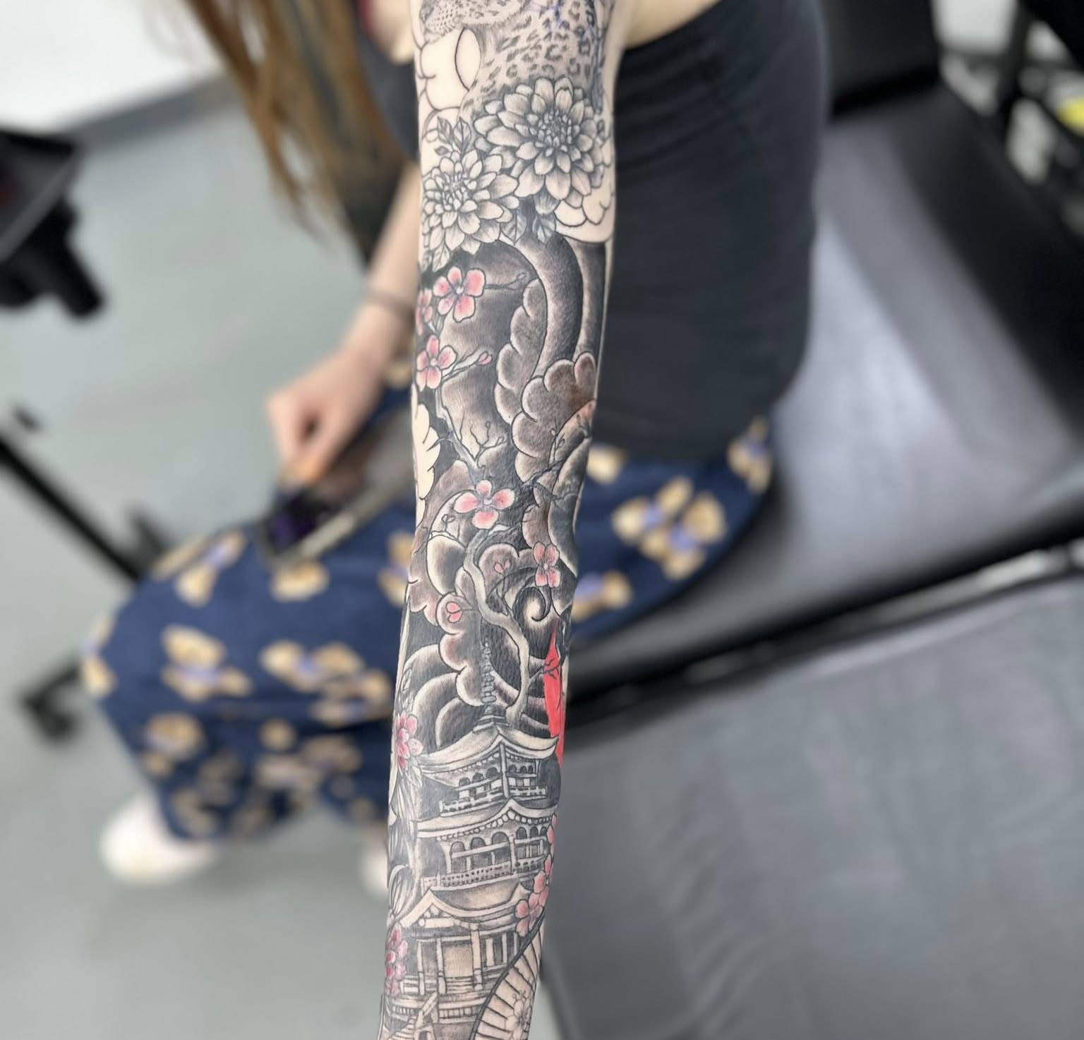 Cherry blossoms and pagoda japanese irezumi tattoo on the forearm by Brian Lambert