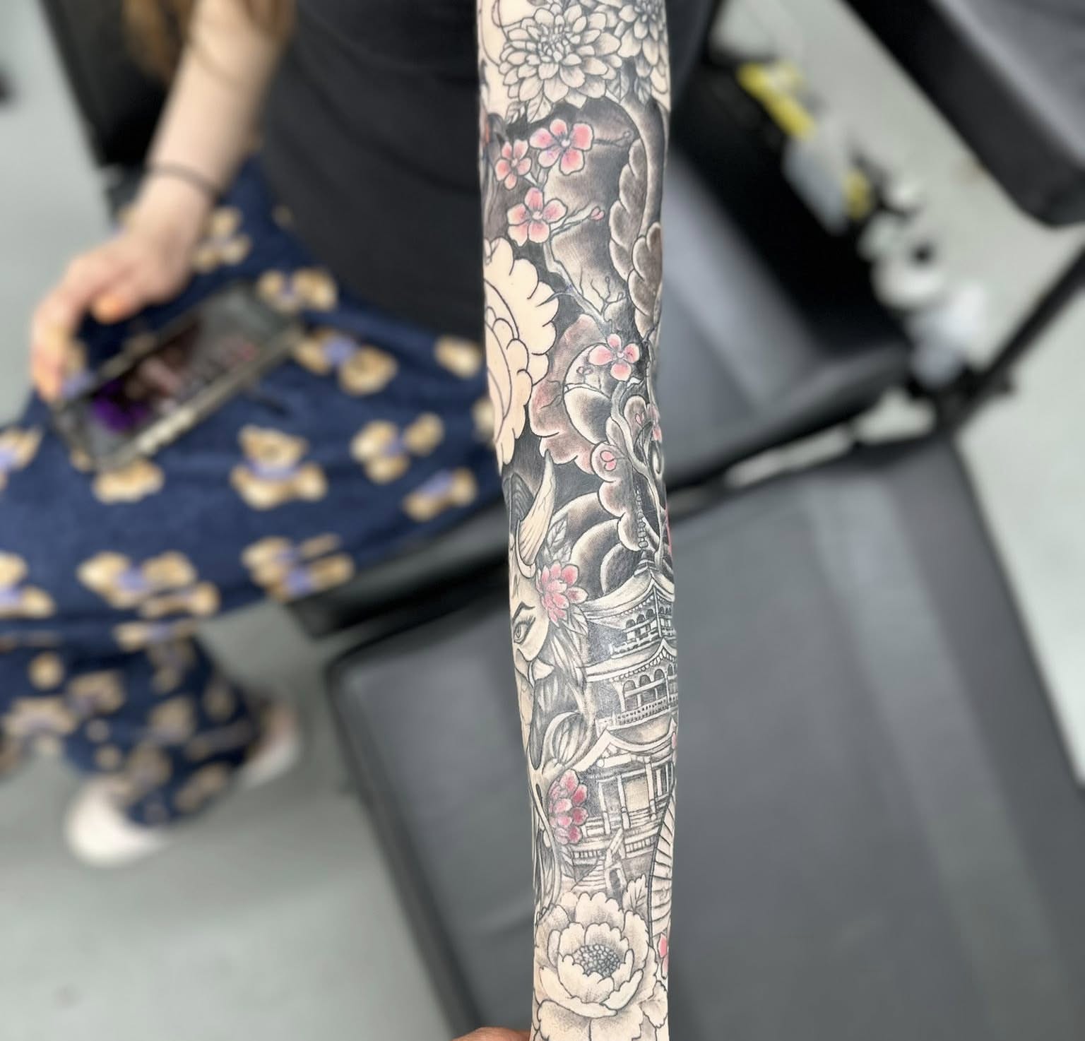 Cherry blossoms and pagoda japanese irezumi tattoo on the forearm by Brian Lambert