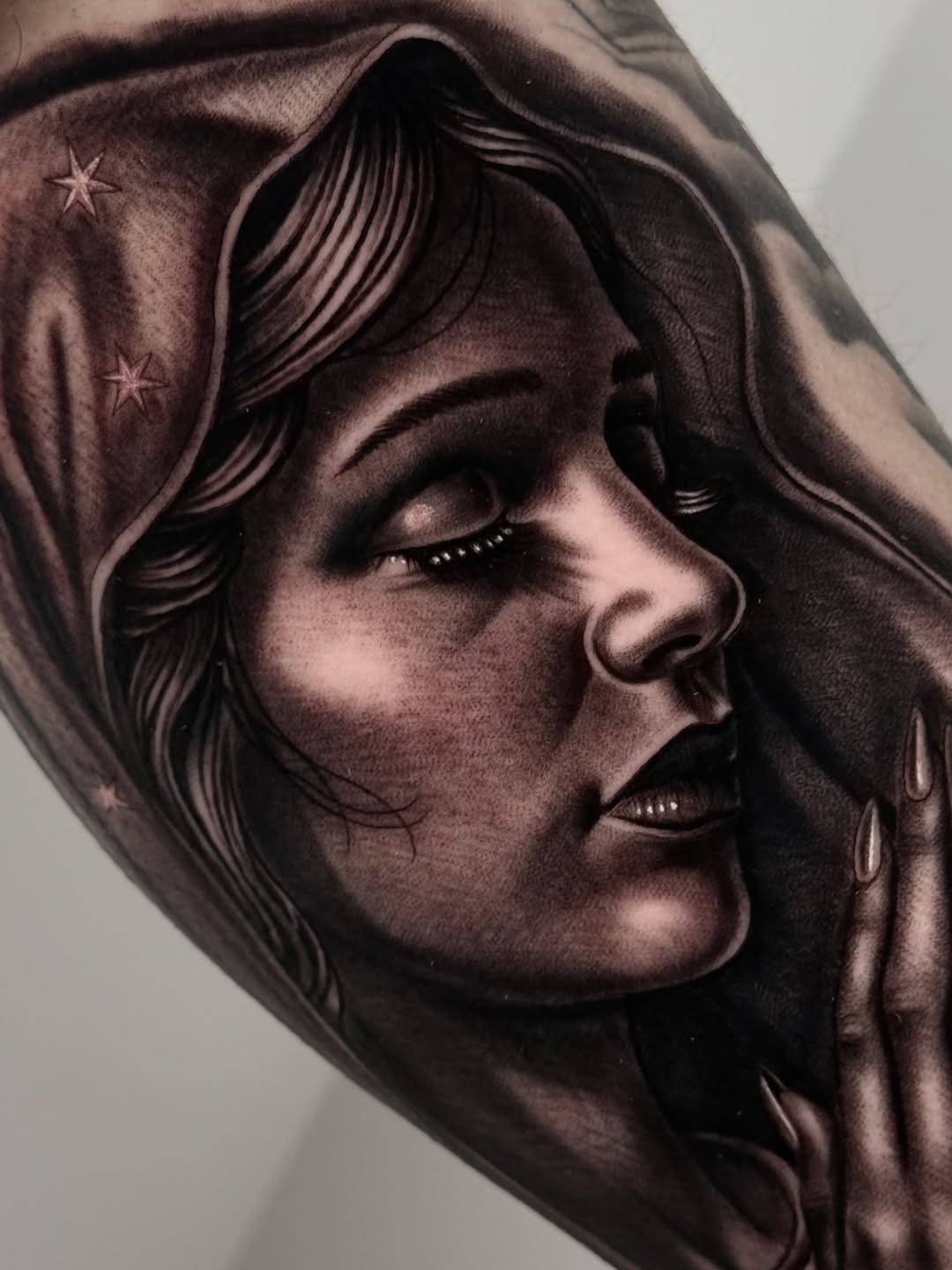 Woman's portrait Chicano tattoo on the forearm by Fernando Andrade Jr