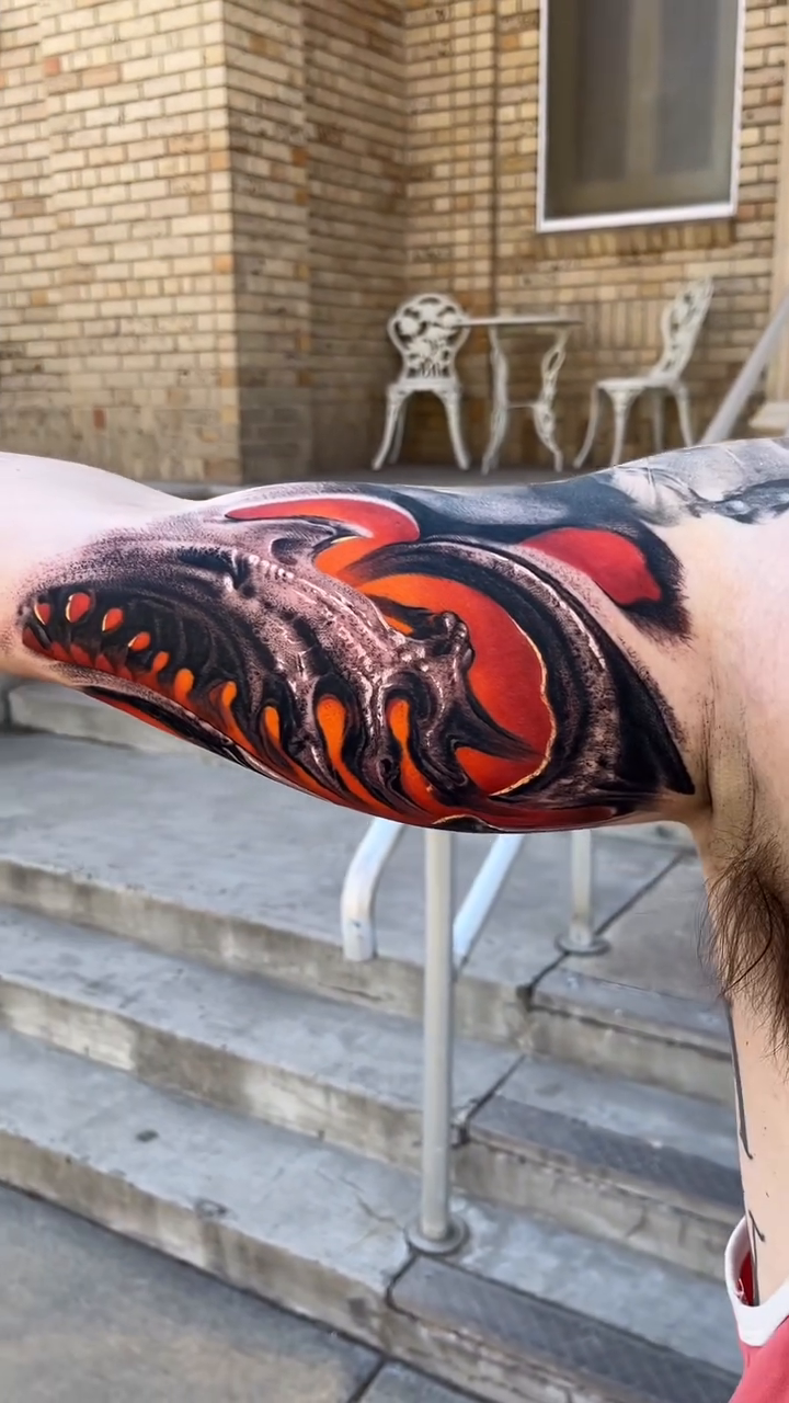 Dragon head tattoo biomech tattoo on the forearm by Jacob Sheffield, Grand Junction, Colorado