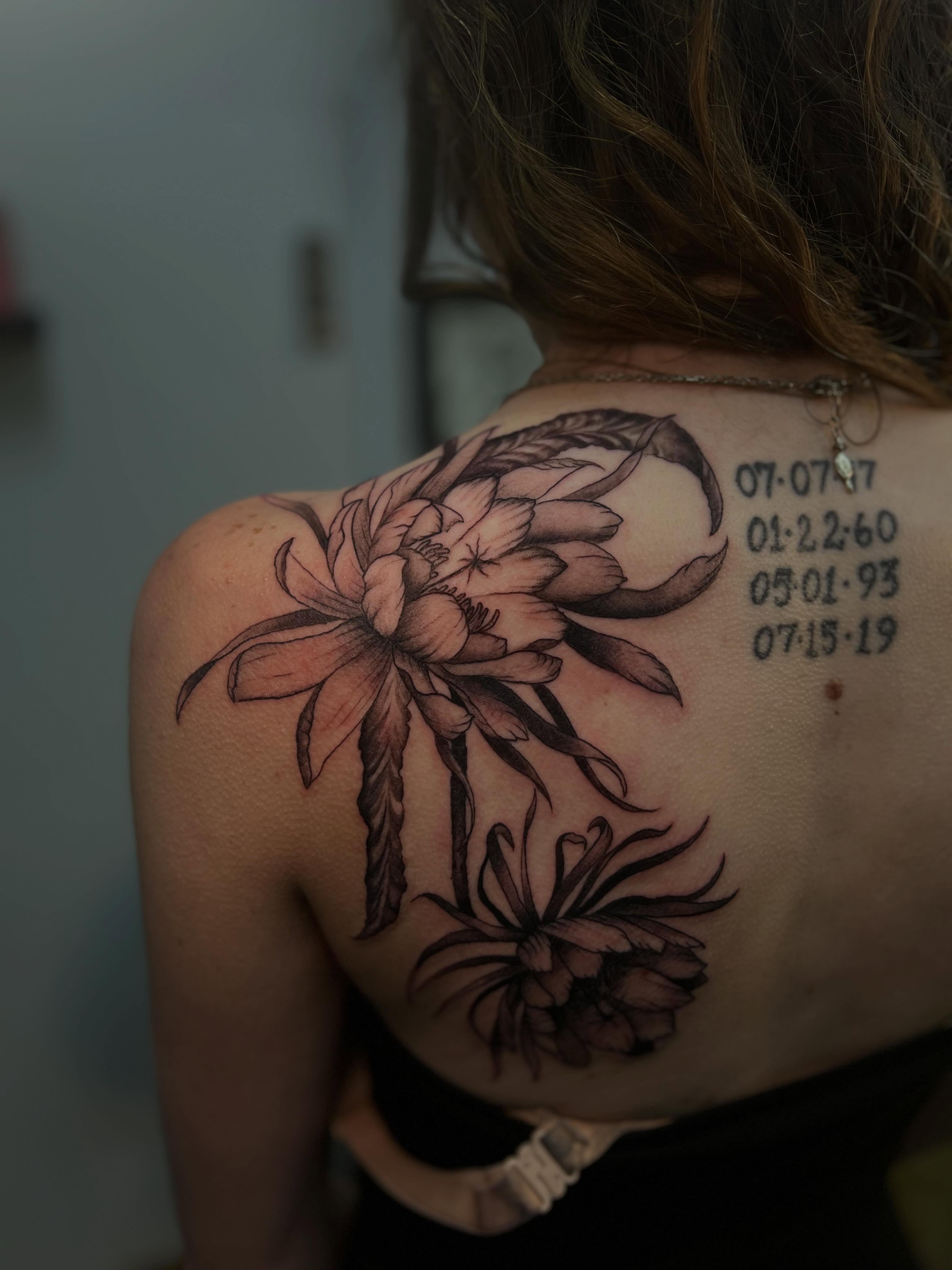 Lotus flowers and scorpion black and grey tattoo on the shoulder by Rebecca Kern Tattoos