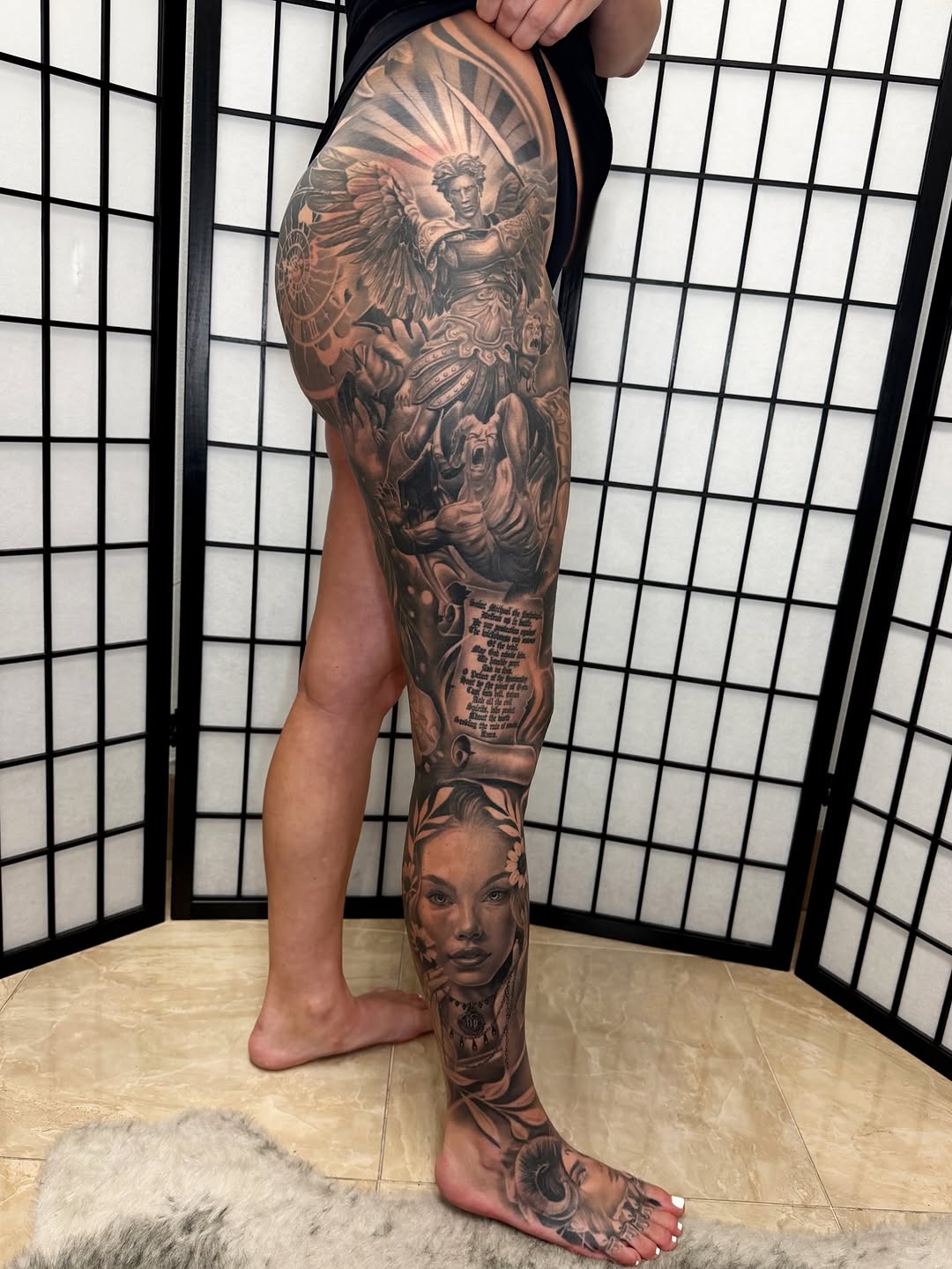 Angel and woman portrait leg sleeve realism tattoo on the leg by Anthony Ramirez