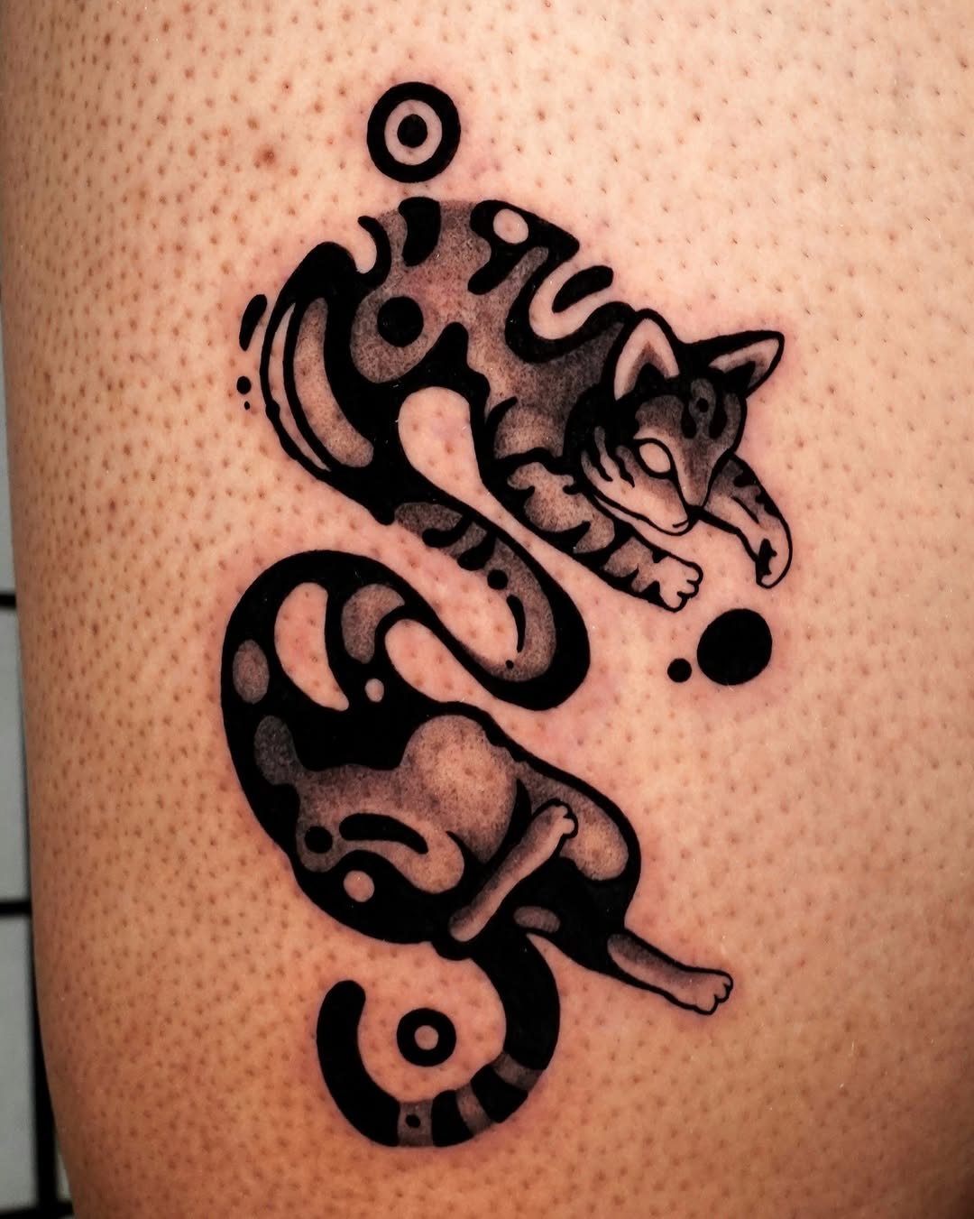 Two cats in a stylized design realism tattoo on the thigh by ▫️◽️◻️hunter Hayes◻️◽️▫️