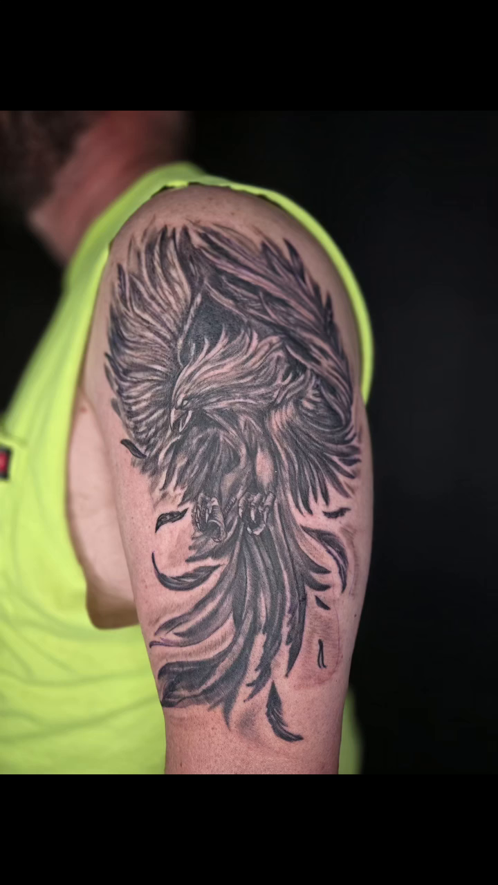 Phoenix tattoo on arm realism tattoo on the upper arm by Karen Cain
