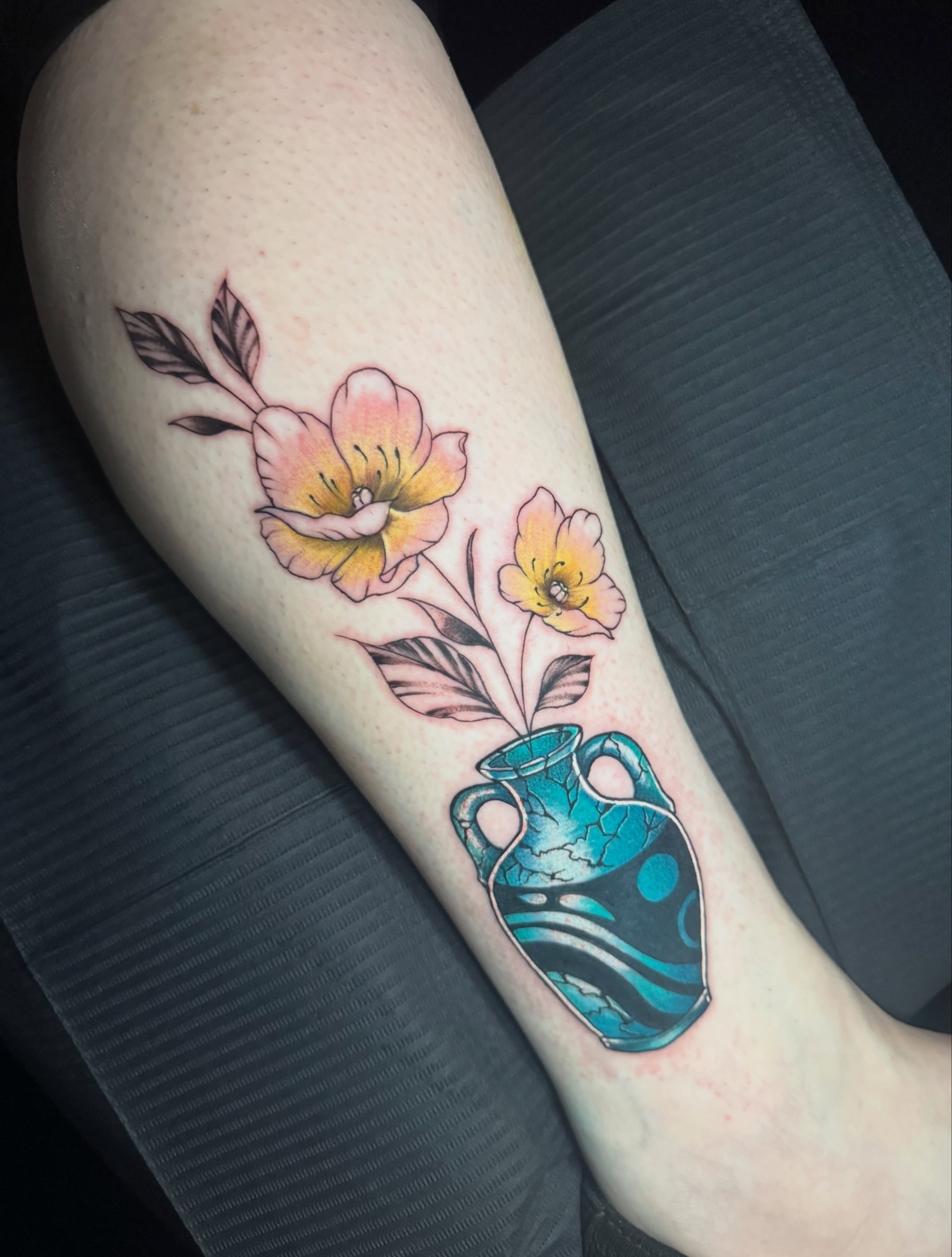 Flowers and vase new school tattoo on the forearm by Dante Singh