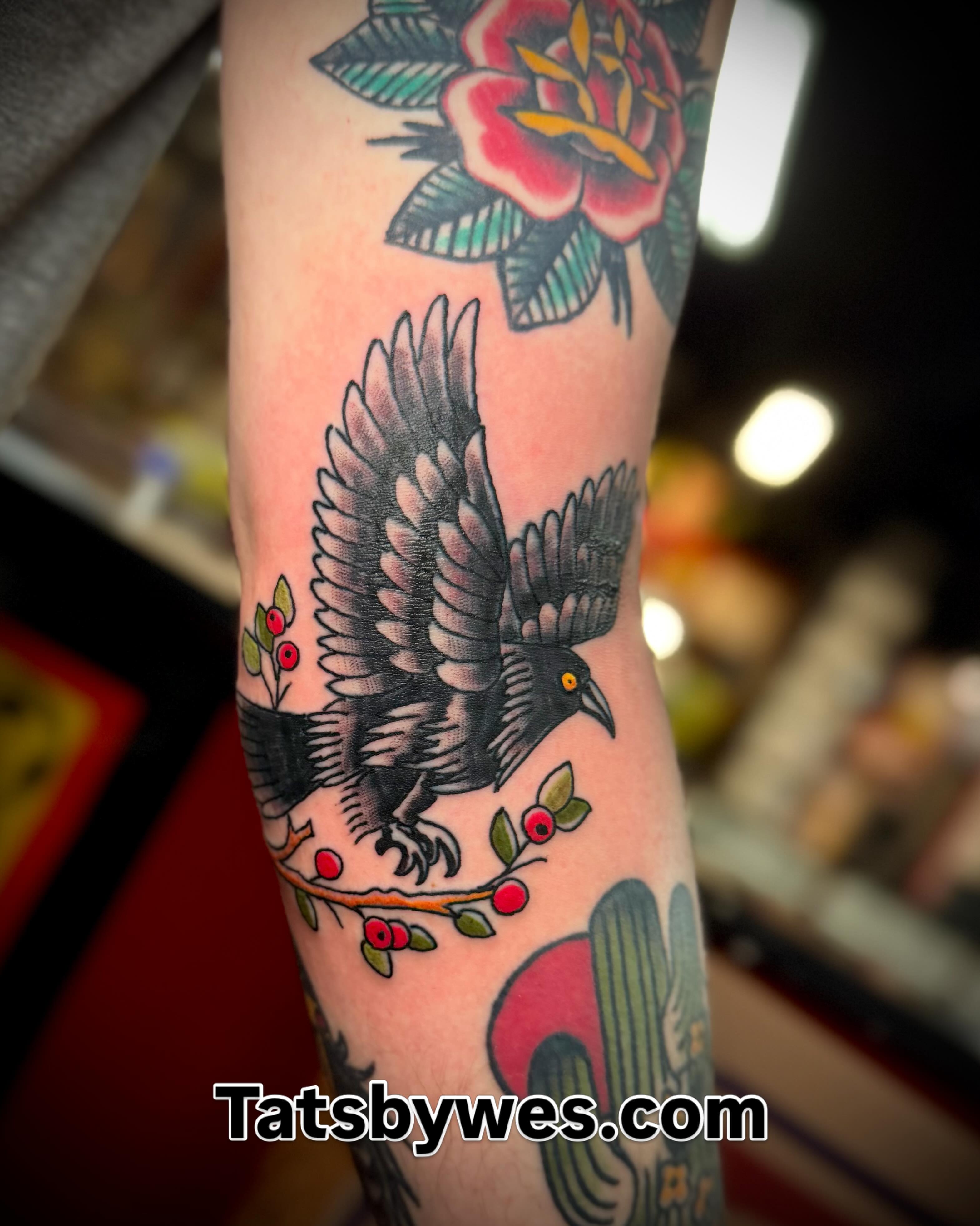 Raven and floral American traditional tattoo on the forearm by 𝐖𝐄𝐒