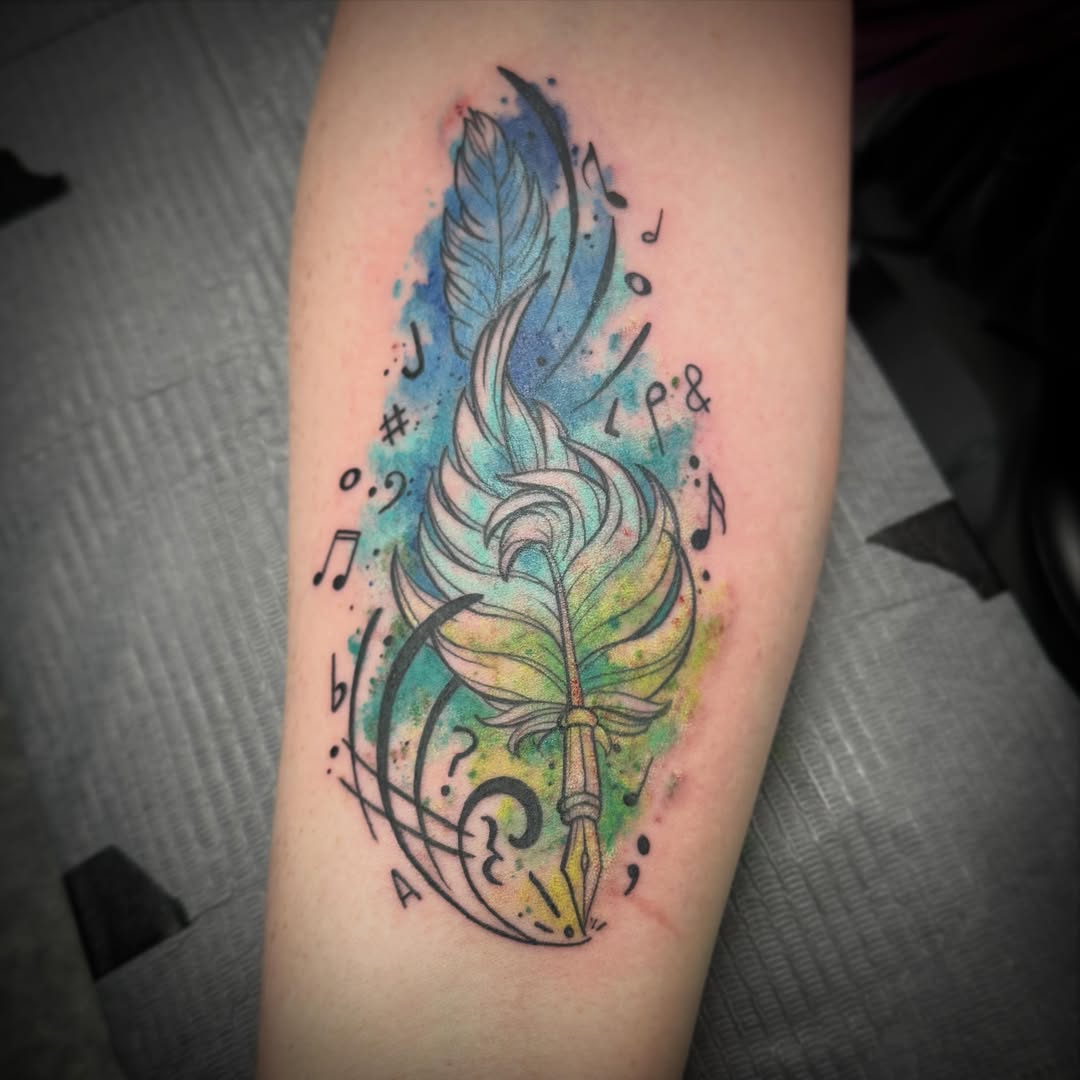 Feather and musical notes watercolor tattoo on the forearm by Darbi "Marbles"