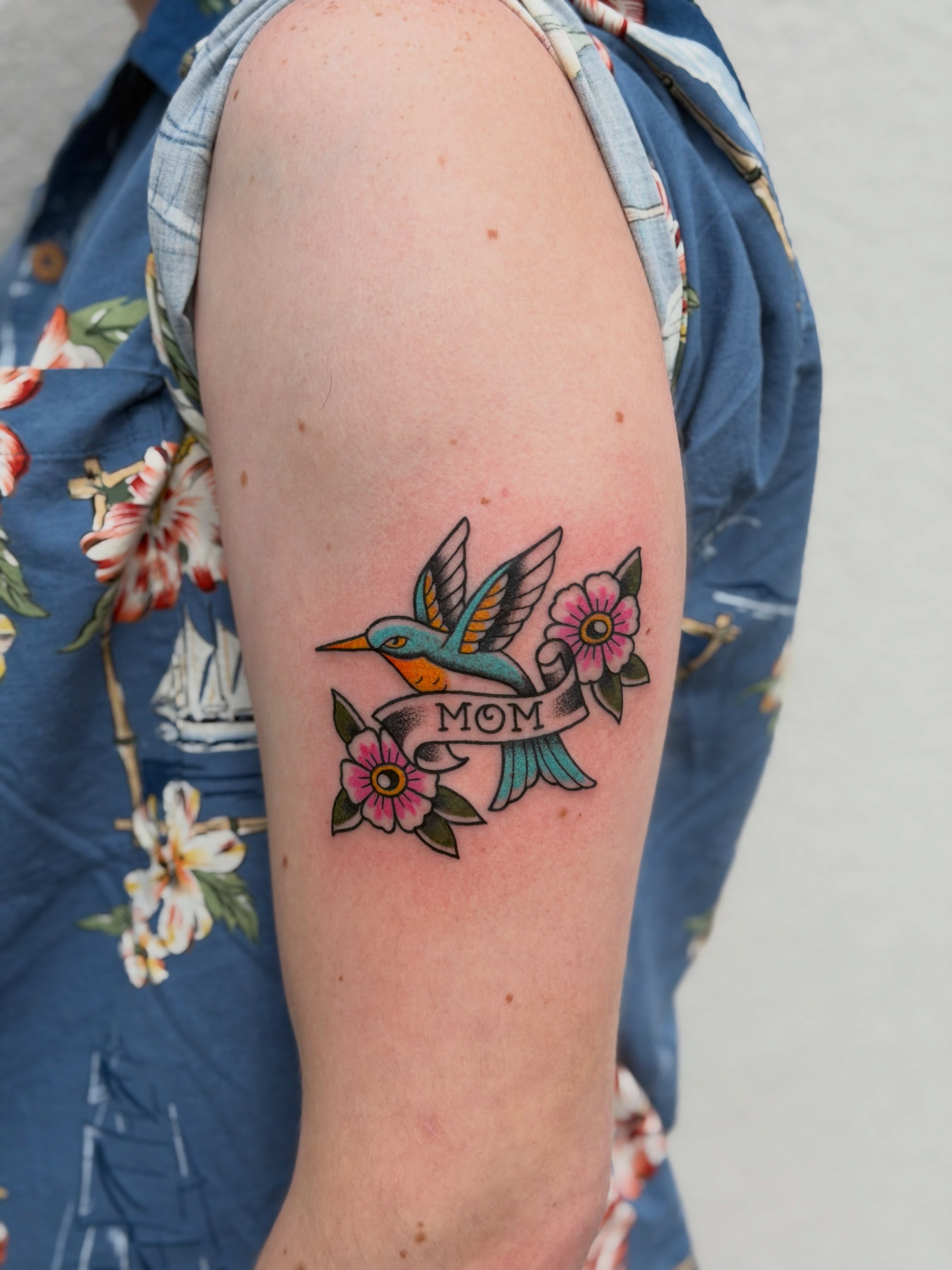 Bird and flowers American traditional tattoo on the forearm by Kailey Ru, Knoxville, Tennessee