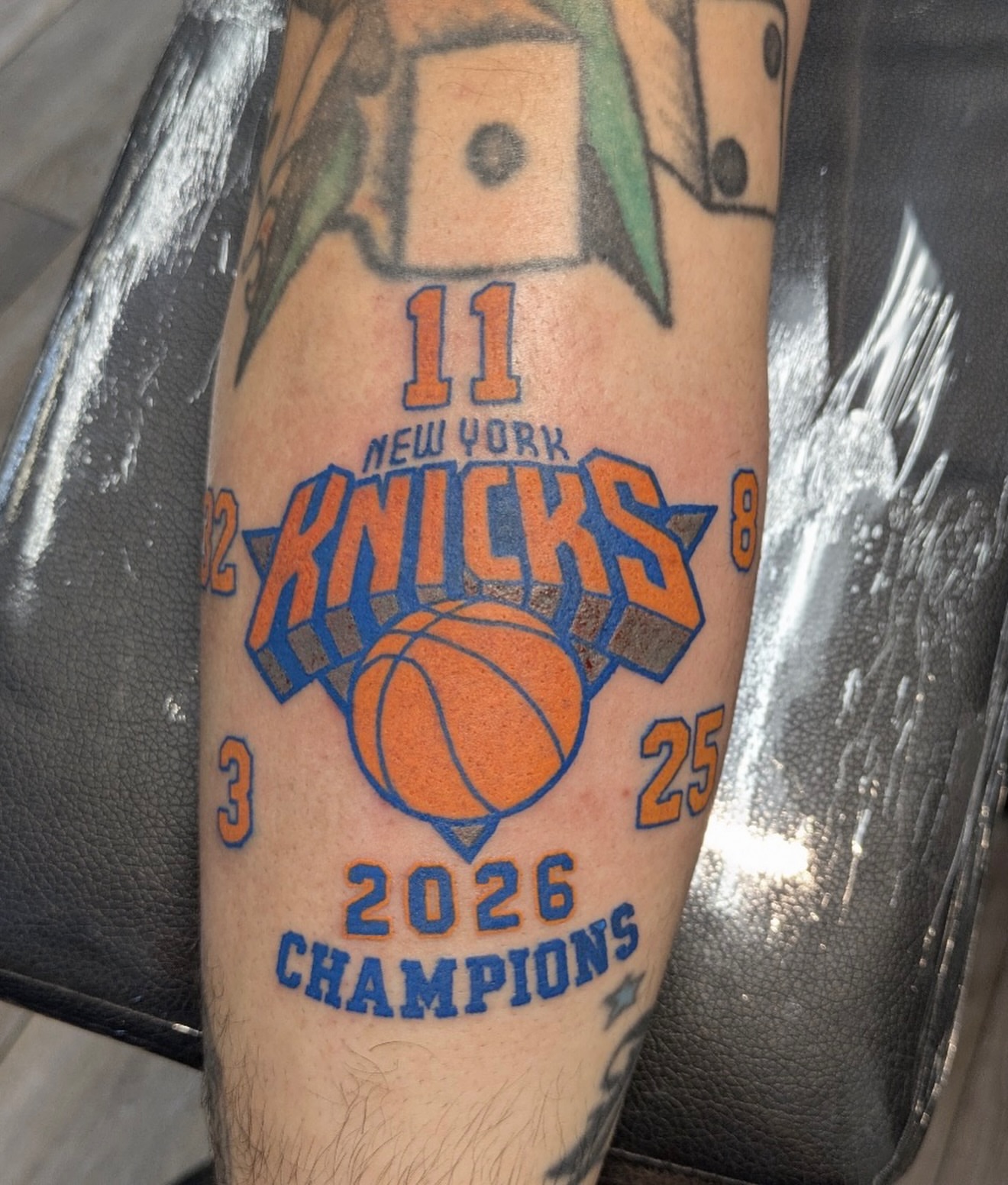 New york knicks American traditional tattoo on the forearm by Buddy K.