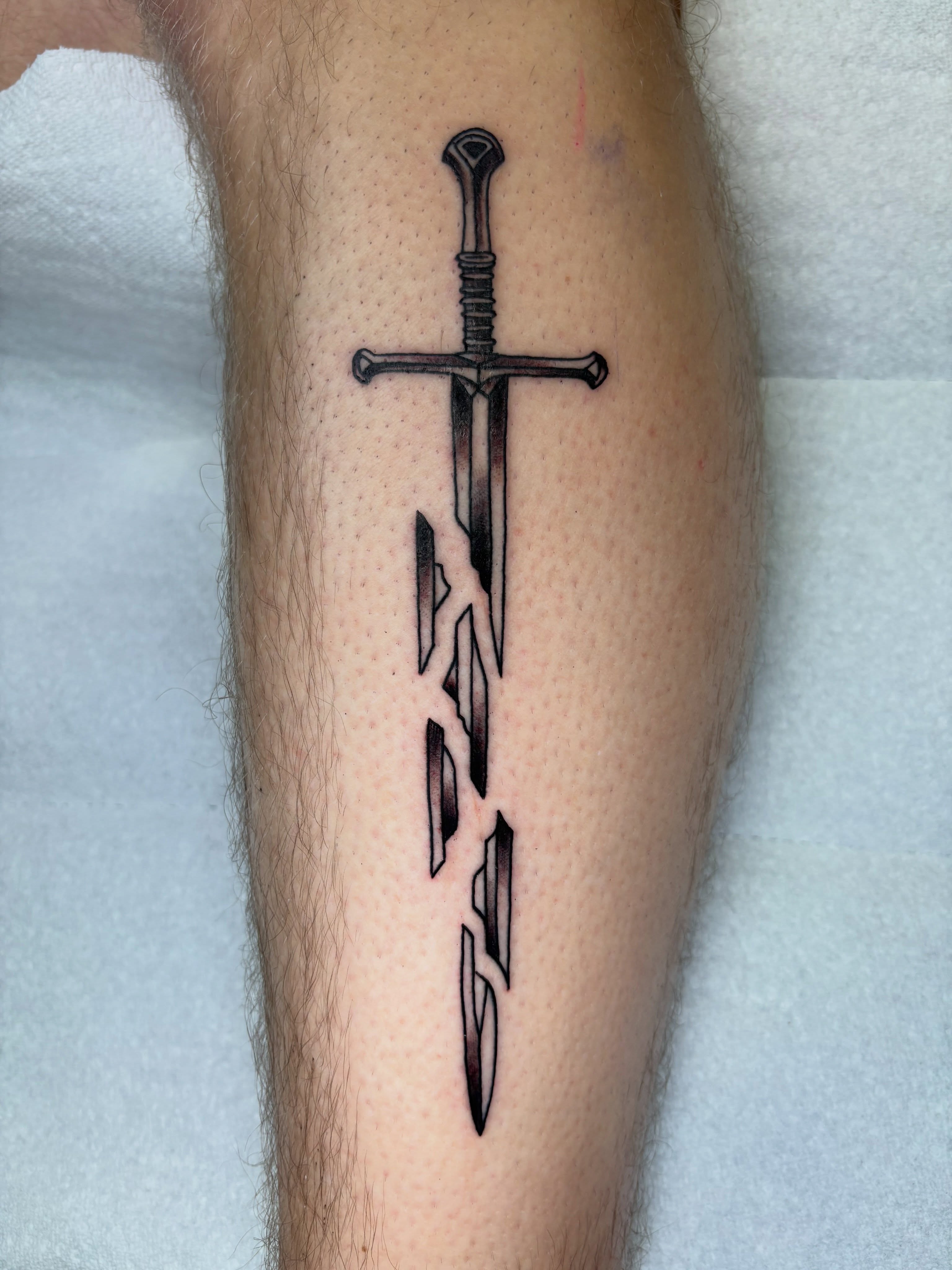 Sword black and grey tattoo on the forearm by AARON MASTERS - Tattoo Artist